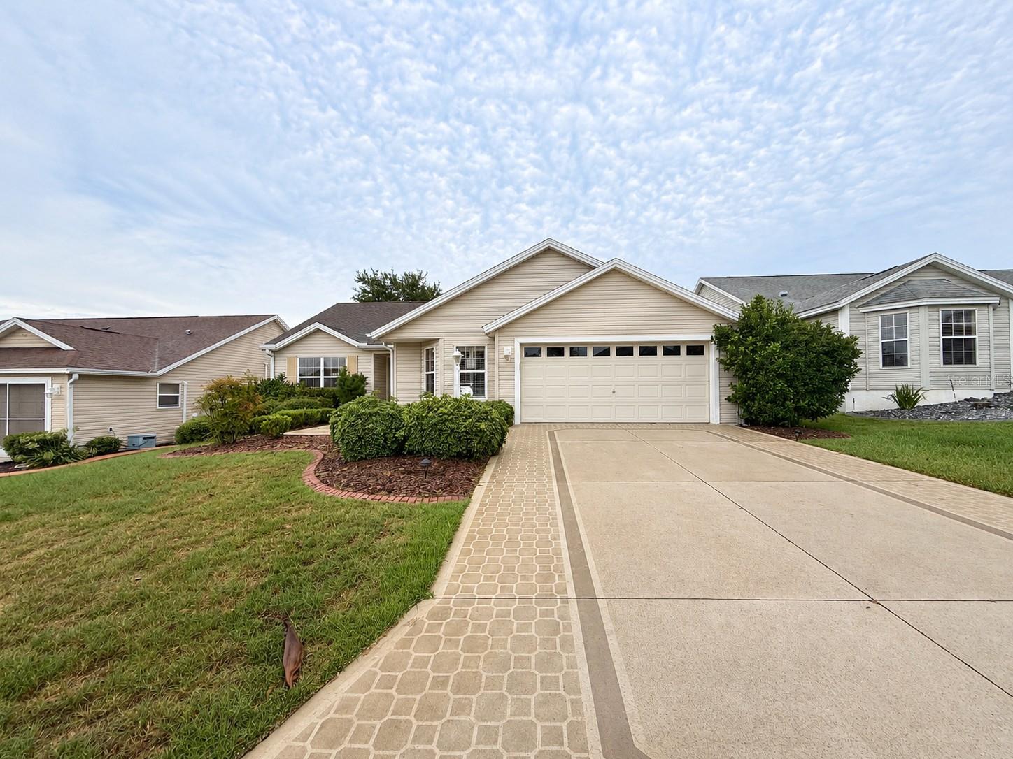 Welcome to this well-maintained 3-bedroom, 2-bath home designed for comfortable living and everyday convenience. This home features a 2-car attached garage and an enclosed back porch—ideal for enjoying your morning coffee, relaxing with a good book, or entertaining guests year-round. The inviting living spaces provide plenty of room for everyday living, while the functional layout makes hosting family and friends a breeze. Located in the highly sought-after community of The Villages, you'll enjoy easy access to shopping, dining, recreation, golf, and an abundance of amenities that make this lifestyle so desirable. Don't miss your opportunity to make this wonderful home your own—schedule your private showing today!