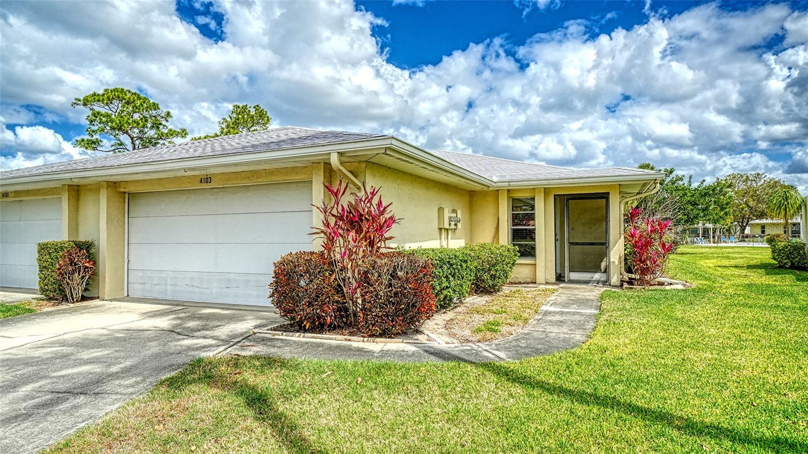 Price Improvement – Sellers Motivated to Sell. Welcome to this spacious Villa in the desirable Center Gate Village community. Offering over 1,600 square feet of comfortable living space, this 2-bedroom, 2-bath villa features a thoughtfully designed floor plan perfect for both everyday living and entertaining.  Enjoy the community pool and creek views right in your backyard. The expansive living and dining areas are filled with natural light, creating a warm and inviting atmosphere. The well-appointed kitchen provides ample cabinetry and workspace, with easy flow into the main living areas. The generous primary suite offers privacy and comfort, complete with a walk-in closet and en-suite bath. A second bedroom and full guest bathroom make this home ideal for visitors or a home office setup. Additional highlights include an attached garage for convenient parking and extra storage, new LVP flooring, interior laundry space, and abundant closet space throughout. Residents enjoy low-maintenance living with HOA-covered exterior maintenance and beautifully maintained grounds, along with access to a community pool. Ideally located in central Sarasota, you're just minutes from shopping, dining, medical facilities/Doctors Hospital, I-75, downtown Sarasota, and the world-renowned beaches of Siesta Key!