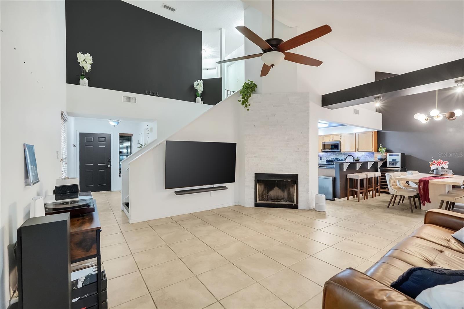 Welcome home to this beautifully modern 3-bedroom, 2-bath, two-story home in the heart of Casselberry in Hollowbrook West! From the moment you enter, you'll appreciate the soaring vaulted ceilings, abundant natural light, and open-concept layout that creates a bright and inviting atmosphere. The first floor features tile flooring throughout the main living areas, a striking white-painted brick wood-burning fireplace, and a beautifully updated kitchen with granite countertops, stainless steel appliances, and ample cabinet and counter space. A first-floor bedroom, full bathroom, and laundry room provide added flexibility for guests, a home office, or multigenerational living. Upstairs, you’ll find wood laminate flooring that extends throughout the stairs and both bedrooms. The spacious primary suite features a walk-in closet and an updated en-suite bathroom with dual sinks and a beautifully renovated walk-in shower, creating the perfect retreat.
The backyard has an oversized covered patio designed for year-round enjoyment. Whether you're hosting family and friends, creating your dream outdoor kitchen, or setting up an outdoor TV for game days, this backyard offers the ideal space to entertain while enjoying Central Florida's beautiful weather. A spacious 2-car garage and a 3-year-old A/C add even more value to this move-in-ready home. Thoughtfully updated and designed for today's lifestyle, this is one you won't want to miss.
Located in a desirable Casselberry community with convenient access to top local amenities, parks, shopping, dining, and schools. Homes in this neighborhood are rarely available, making this a unique opportunity!
