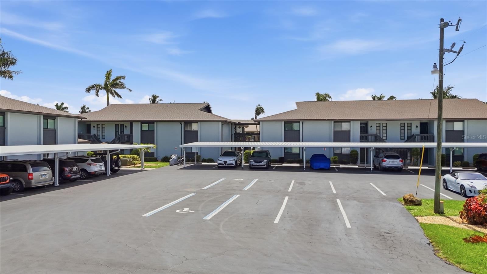 Waterfront living meets ultimate peace of mind! This immaculate 2-bedroom, 2-bathroom second-floor unit features stunning water views from its oversized, newly screened lanai. Inside, you’ll find a total 2025 transformation with top-of-the-line updates, including 2026 appliances, newer washer/dryer, a 2025 AC system, and modern PVC plumbing. Boaters will love the first-come community docking equipped with water and electricity, along with a community pool and BBQ pavilion. The meticulously maintained association features brand-new carports, a newly sealed parking lot, fresh landscaping, and a new seawall cap. With a well funded HOA and all assessments already paid, this turnkey gem is ready for its next owner!