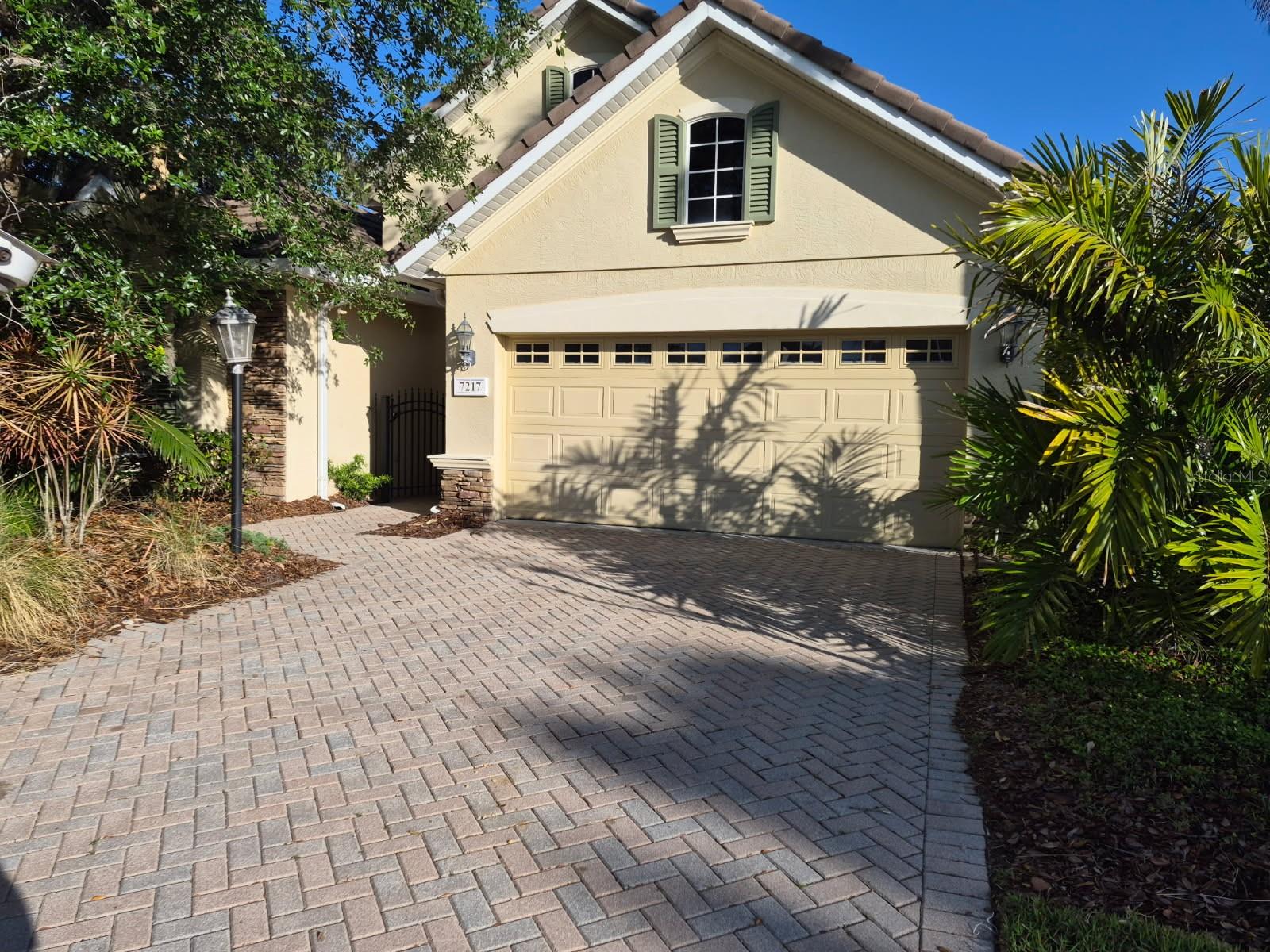 Beautiful home in Lakewood Ranch Country club, Orchid Island Village.   Spacious 2 bedroom 2 bath home with den/library, large lanai and 2 car garage.  No private pool but home is next door to community pool which is very well taken care of.   Large open space perfect for a family to gather and Association fees include mowing the yard for you!   Gated community, Great schools, easy access to Interstate 75 and minutes away from our gorgeous beaches!   Close to any shopping you desire - UTC MALL close by - and too many restaurants to mention!!