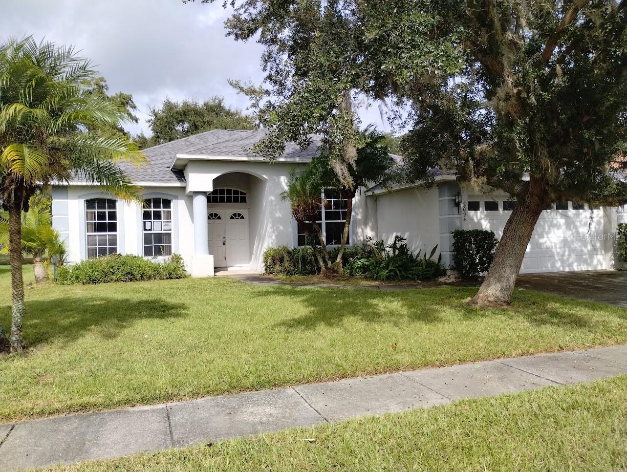 Welcome home to your 3 bedroom, 2 bath home that is located in the Golf Club and Community of "The Oaks". The home has extensive ceramic tiled flooring and a screened porch that provides a great view of the golf course and did I mention a tranquil water view of the pond. A great floor plan with a nice sized primary bedroom that has a great view and check out the primary bath with dual sinks. The home has two other accommodating bedrooms and a second bath. The kitchen is nicely sized and everyone will enjoy the breakfast bar that extends out to the living room that has extensive tile flooring. With the low inventory, location with golf course and pond view along with a relaxing screened porch this is a must see. The home is located in close proximity to shopping, schools, restaurants, The Loop and the Florida Turnpike.