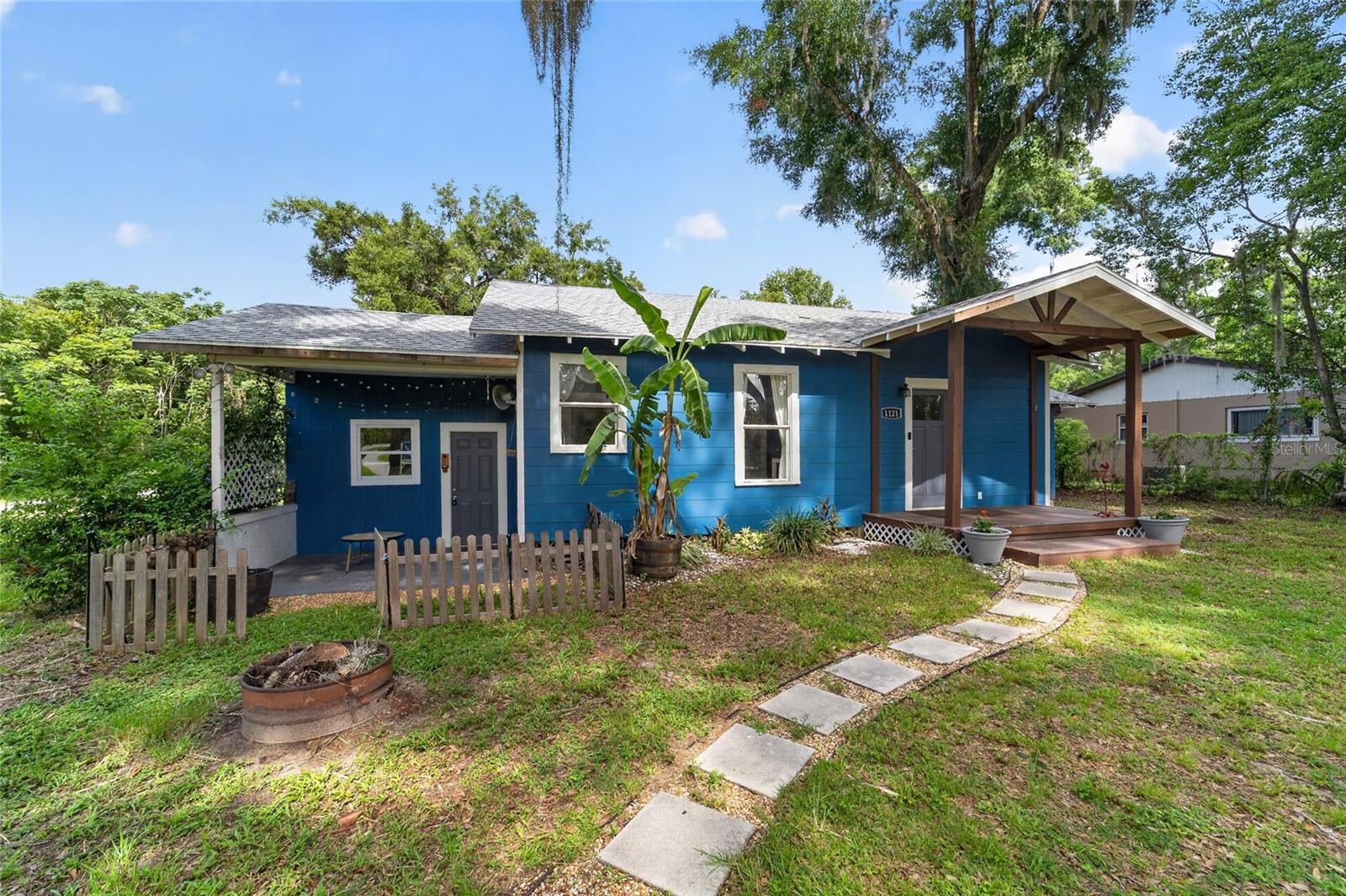 ** Charming Cottage on a Spacious Corner Lot in SE Ocala! ** From the moment you arrive, you'll fall in love with the character and curb appeal of this adorable 3-bedroom, 2-bath cottage situated on a generous 0.39-acre corner lot in desirable SE Ocala. Beautifully renovated in 2020, this home offers the perfect blend of timeless charm and modern updates. Step inside to discover a bright, open floor plan featuring solid surface countertops, a stylish designer backsplash, and an inviting living space filled with natural light. The split-bedroom layout provides added privacy, making it ideal for families, guests, or a home office setup. Major improvements offer peace of mind, including a 2025 roof, 2026 drainfield, HVAC system replaced in 2020, and an electrical upgrade completed in 2017. Whether you're enjoying your morning coffee indoors or taking advantage of the spacious yard outside, this home is move-in ready and designed for comfortable living. Conveniently located near shopping, dining, medical facilities, schools, parks, and everything Ocala has to offer, this charming cottage is the perfect place to call home. Don't miss your opportunity to own this beautifully updated gem in a fantastic location!