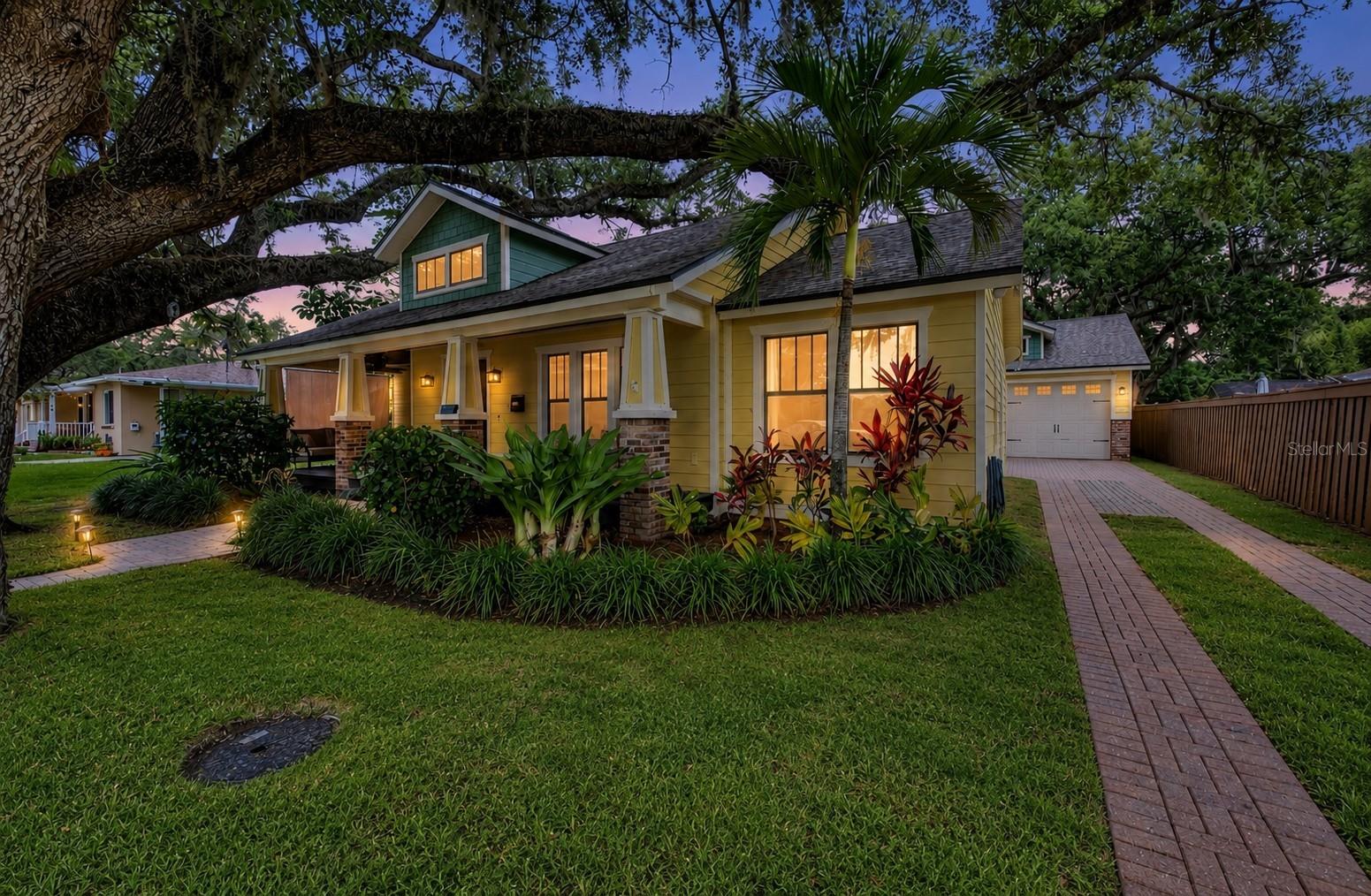 Enjoy sunset views of the Hillsborough River from your oversized front porch (and nearly every room in the house) with this one-of-a-kind custom-built home located directly on Rivercrest Park. One of only a handful of lots in the Tampa Bay area that combines waterfront views with the peace and comfort of living high and dry in Flood Zone X, this beautiful block-construction bungalow maintains the original craftsman charm of the historic neighborhood without sacrificing modern amenities. Built in 2008, this home is move-in ready with smart-home technology, professional kitchen appliances (including a Viking fridge and a Fratelli Onofri gas range), a whole house water filtration system, an electric water heater, industrial-grade flooring, an energy-efficient dual-zone AC system, wall-mounted frame TVs and a Bose surround sound home theatre system. Unique features include a wood-burning fireplace, a spa-like step-down master shower with stone walls and dual shower heads, a second-floor in-law suite complete with coffee bar that could double as the perfect playroom, a breakfast nook and a built-in wet bar off the kitchen, a murphy desk bed in the front room for maximum flexibility, and an oversized 2-car garage with enough room to store all your toys next to the integrated workshop. The park is also undergoing a $1 million+ renovation consisting of a new boardwalk, boat slips, kayak launch and fishing pier, and a 22-mile interconnected pedestrian and bicycle network known as the “Green ARTery” runs right through the neighborhood, connecting you to Armature Works, Tampa Riverwalk and downtown via dedicated bike lanes (not to mention all the Seminole Heights bars and restaurants are reachable without crossing a single intersection). Perfect for those who want to be close to the heart of the city yet still enjoy a quiet and peaceful escape from the hustle and bustle of downtown, this highly coveted neighborhood is a dream, complete with jogging path and playground across the street, yoga in the park on the weekends, more Halloween trick-or-treaters than you’ll have candy for, and a real sense of community, the heartbeat of which literally lies at your doorstep.
