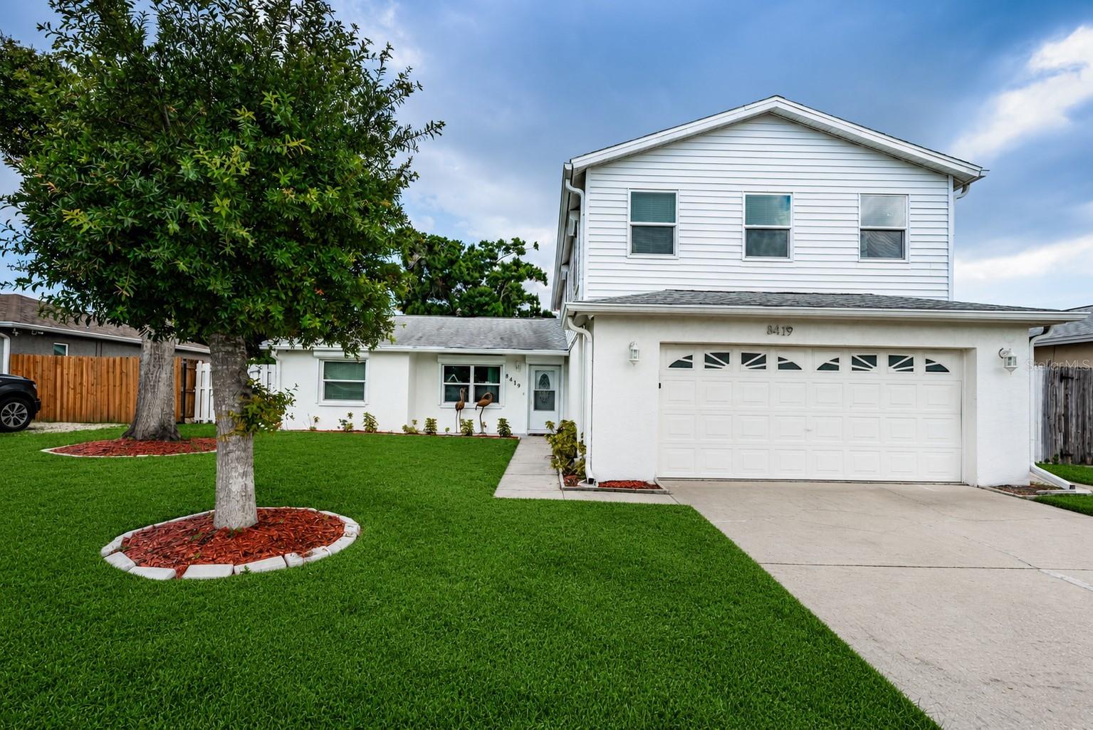 Welcome home to this spacious 5-bedroom, 3-bathroom, 2-story home with a 2-car garage, ideally located in desirable unincorporated Largo! Offering a flexible floor plan, the first floor features a private in-law suite, two additional bedrooms, an updated full bathroom, and beautiful new tile flooring throughout. The updated kitchen boasts wood cabinetry, quartz countertops, and plenty of workspace, making it the heart of the home. Upstairs, you'll find luxury vinyl flooring throughout, including the spacious primary bedroom and an oversized second bedroom. The upstairs bathroom offers a functional layout with a private toilet area, his and her sinks, separate shower, relaxing garden tub, and dual access from both bedrooms. Step outside to the expansive covered and screened patio—perfect for entertaining family and friends year-round while overlooking the oversized backyard with plenty of room for a pool, boat, RV, or all your outdoor toys. Additional features include newer A/C units, hurricane shutters on all windows for added peace of mind. Conveniently located near shopping, restaurants, parks, entertainment, beautiful Gulf beaches, and major commuting routes, this home combines space, versatility, and an unbeatable location. Don't miss this incredible opportunity to make it yours!