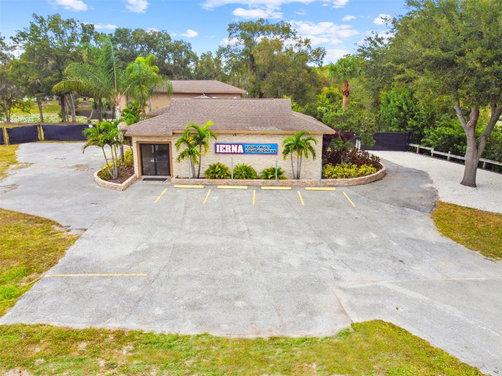Very unique opportunity to acquire a fully remodeled freestanding office building setting on 1.48 acres along a major 6-lane highway with tremendous expansion possibilities. Previously 2 separate parcels, combined into one large parcel now featuring over 300ft of SR-54 frontage with a traffic count exceeding 56,000 cars daily.  Terrific visibility with large lighted monument signage along SR-54.  Less than half of the site is currently developed providing ample space for additional structures and/or expansion. Located within Pasco County which is one of the fastest growing counties in FL, boasting a robust economy, massive housing PUD’s, and immediate access to world-class amenities.  Nearby major businesses include Lowes, CVS, Tampa Premium Outlets, Publix, and Walmart. Local demographics of more than 100,000 residents and average household income over $100,000. This LAKEFRONT site is very private and bordered by state property to the East, GTE Credit Union to the West, and a beautiful lake to the North with terrific views from multiple offices. Just minutes to I-75, US-41, and the Suncoast Parkway providing rapid access to downtown Tampa and Tampa International Airport. The fully remodeled 2-story block construction office building includes 12-14 private office spaces, 2 updated bathrooms, updated kitchen, large receptionist office, lobby area, custom glass doors, 4 private entrances, oversized storage room with overhead door option, full LED lighting throughout, wood laminate flooring, and a large fenced/gated area for storage of vehicles and/or equipment. Currently vacant, presenting the chance for an end-user to customize the space to meet their business needs, or for an investor looking for a piece of property in this rapidly expanding market. C-2 Zoning provides for a very wide array of business & retail uses.  See documents for details. Possible owner financing.