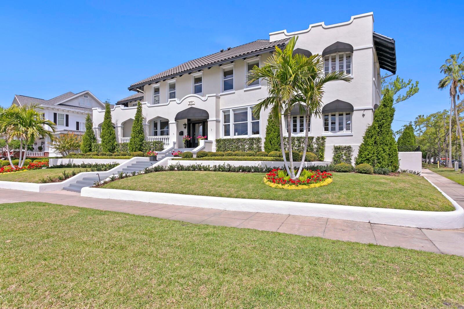Immerse yourself in Bayshore Historic Ambiance overlooking Tampa Bay on coveted Bayshore Boulevard. This legacy property delivers stunning panoramic water views and grandeur at every turn. Magnificently and completely renovated by the current owners with modern appointments while preserving this circa. 1912, Mediterranean Revival architecture. This grand gated entertaining estate provides the opulent comfort for living today with ample large rooms for social gatherings and events. Boasting fine craftmanship and period details, from the elegant entry, wide portico and impressive stairway to the outdoor entertaining areas, manicured lawn, pool with travertine pool deck and beautifully appointed carriage guesthouse. Gleaming hardwood floors welcome you to refined living spaces and soaring ceilings on the first level that include a family room, formal living and dining room, music room, bonus room and office. The outstanding renovated chef’s kitchen provides top-of-the-line appliances and finishes, professional 12-burner gas stove, center island and pantry storage. A grand stairway or elevator leads to the second level offering a primary suite retreat with a separate sitting area/office, executive closet and luxurious bath. Three additional bedrooms, multiple unit laundry room and a light-filled bonus room overlooking the bay complete the second level. The third level offers the perfect open area for enjoying guests, or a good book, with a domed skylight, exposed brick and hardwood floors. A full 3,800 sqft unfinished basement (not included in square footage) provides ample storage and other opportunities. A detached guest house features 1 bed/1 bath and kitchenette.  Offering complete system upgrades throughout, from window upgrades and skylights to plumbing and electrical service, new whole home generator, Control 4 smart home technology, elevator, new roof, full video security system, California Closet systems, and  6 energy-efficient HVAC units. Additional appointments include renovated baths, Chicago brick floor in the morning room, cove lighting in the formal living areas, gas fireplace, secured entry gates and a garage with additional secured parking opportunities on the property.  Known as one of the longest continuous sidewalks in the United States, Bayshore Boulevard is 4.5 miles of scenic views paralleling Tampa Bay. Located near great shopping and restaurants, Hyde Park Village, exhilarating nightlife and A-rated schools. Enjoy all the South Tampa lifestyle has to offer including walking and biking, an intrinsic art scene, sports venues, and the ease of access to airports and a vibrant downtown.