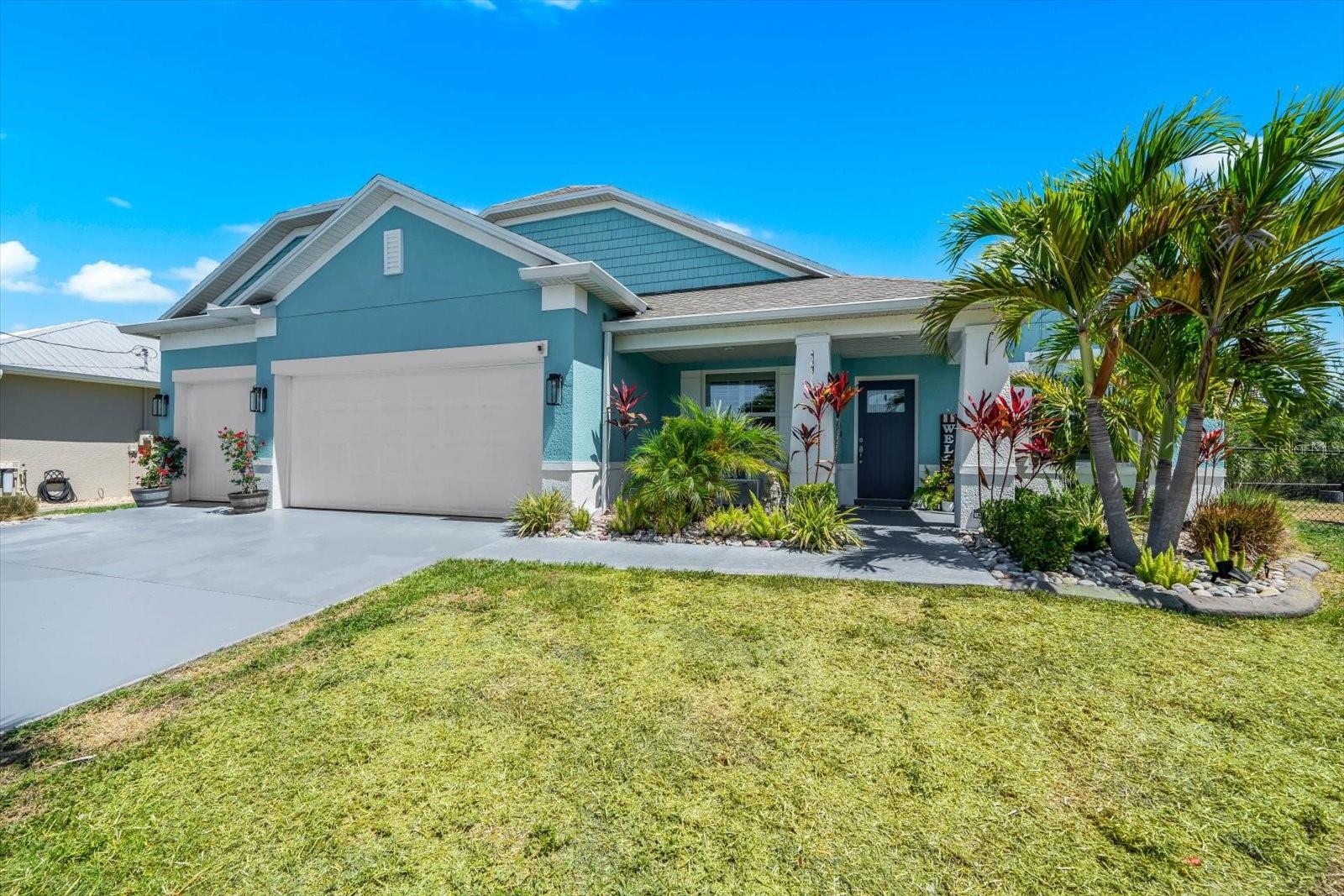 Welcome to your private slice of paradise in the waterfront community of South Gulf Cove! Perfectly positioned on a rare DOUBLE LOT with stunning intersecting canal views, this beautifully finished 4-bedroom + den, 3-bath home offers over 2,400 square feet of thoughtfully designed living space, a spacious 3-car garage, and exceptional indoor and outdoor entertaining areas. Boating enthusiasts will appreciate the impressive waterfront setup featuring a 10,000-LB boat lift with canopy, an expansive 33 x 10 dock, a wraparound dock offering convenient dual-side boat access, and stunning intersecting canal views.
From the moment you arrive, the home’s lush tropical landscaping, mature palms, decorative stonework, and impressive curb appeal set the tone for the quality found throughout. Inside, the open-concept floor plan blends comfort and functionality with tile and LVP flooring throughout, crown molding, plantation shutters, decorative pillars, custom finishes, and abundant natural light. The spacious great room seamlessly connects to the kitchen and outdoor living spaces through oversized sliding glass doors, creating the perfect setting for entertaining or everyday waterfront living.
The kitchen is beautifully appointed with updated appliances, granite countertops, under-cabinet lighting, abundant cabinetry, a massive center island, and a decorative backsplash. The formal dining space is ideal for entertaining, while the additional den and bonus room offer flexibility for a home office, media room, or extra guest space.
Designed with privacy in mind, the split floor plan offers two ensuite bedrooms, making it ideal for guests or multi-generational living. The spacious primary suite is a true retreat featuring tray ceilings, plantation shutters overlooking the sparkling pool and canal, a walk-in closet, custom built-ins, a large soaking tub, and a tile walk-in shower with glass doors. Guest rooms are generously sized, with a well-appointed guest bath between them, while the second ensuite is at the opposite end of the home, offering a large bedroom with a full bathroom. All bedrooms offer beautiful natural lighting, ceiling fans, and well-appointed finishes.
Step outside into your tropical waterfront oasis where the screened lanai, heated pool, spa, expansive entertaining pool deck, and covered outdoor living areas create the ultimate Southwest Florida lifestyle. Whether enjoying peaceful mornings overlooking the intersecting canals, hosting family and friends, or heading out for a day on the water, every detail of this property was designed to embrace true waterfront living. Additional highlights include hurricane protection, an indoor laundry room with a GE washer and dryer, built-in cabinetry, an outdoor shower, decorative exterior lighting, and an extensive outdoor entertaining space, which is rarely found in today’s market.
This exceptional property combines gorgeous, spacious living, a double waterfront lot (160 feet of waterfront), incredible boating amenities, and one of the most desirable waterfront settings South Gulf Cove has to offer.