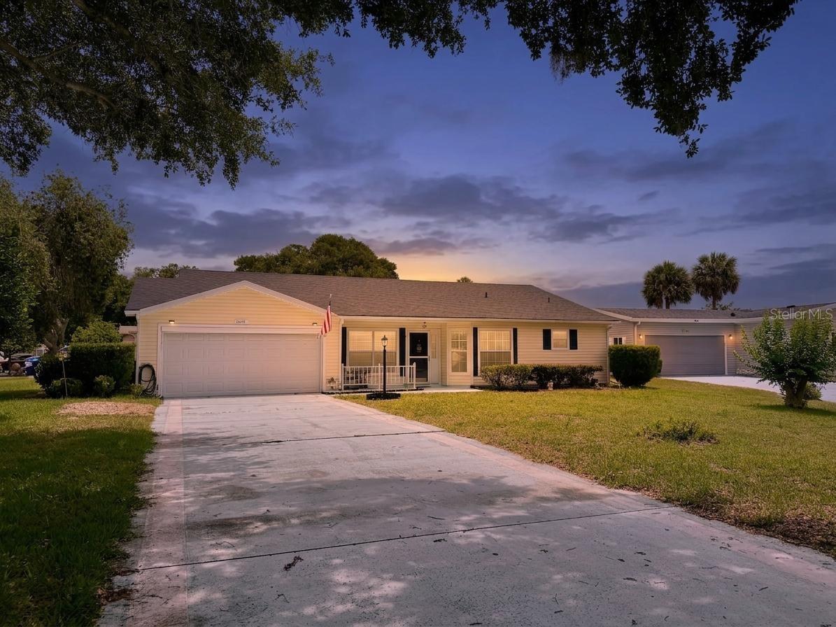 One or more photo(s) has been virtually staged. Welcome to resort-style living in the sought-after 55+ community of Plantation at Leesburg. Situated on an oversized corner lot at the end of a quiet cul-de-sac, this beautifully maintained 2-bedroom, 2-bath home with a dedicated office/den offers comfort, functionality, and an active Florida lifestyle.

Inside, you’ll find a spacious layout featuring luxury vinyl plank flooring in the living room, dining room, and primary bedroom, ceramic tile flooring throughout the main living areas, and plush carpet in the guest bedroom. The kitchen is equipped with Corian countertops, ample cabinetry, and a functional layout perfect for everyday living or entertaining. Updated vanities add a modern touch to both bathrooms, while the primary suite features a large walk-in closet and an oversized walk-in shower.

Enjoy year-round relaxation in the enclosed screened Florida room complete with ceiling fans, creating the perfect extension of your living space. Additional highlights include a covered front porch, mature landscaping, and a spacious 2-car garage.

Residents of Plantation at Leesburg enjoy access to an incredible lineup of amenities including 3 clubhouses, 3 resort-style pools, 36 holes of golf, an on-site restaurant, and a vibrant social atmosphere with activities and events throughout the year. Conveniently located near shopping, dining, medical facilities, and major roadways, this home offers the perfect blend of comfort, convenience, and community living.