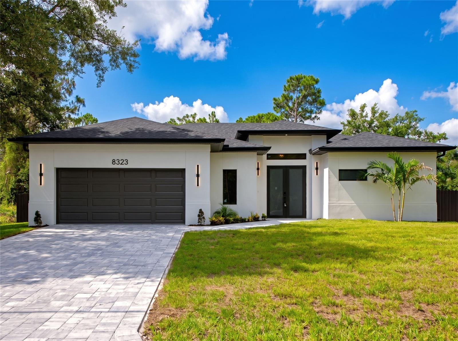 Welcome to your Florida dream home! This stunning semi-custom new construction offers 3 bedrooms, 2 bathrooms, plus a spacious den that can easily serve as a home office, guest room, or 4th bedroom. The thoughtfully designed open floor plan creates a bright and inviting living space, perfect for entertaining and everyday living.
Designed with modern elegance and comfort in mind, this home features soaring high ceilings, luxury vinyl flooring throughout, impact-resistant windows and doors, quartz countertops, oversized custom cabinetry, designer lighting, and beautifully appointed bathrooms with today’s most sought-after finishes.
Step outside to your private backyard oasis featuring a sparkling pool, covered tiled lanai, extended paver deck, and a fully fenced backyard, providing privacy, security, and the perfect space for family gatherings, pets, and outdoor enjoyment. Additional highlights include a modern energy-efficient A/C system, a spacious 2-car garage, and premium craftsmanship throughout.
Located in one of North Port’s most desirable areas, this property is NOT in a flood zone and has NO HOA or CDD fees. Conveniently situated near I-75, shopping, restaurants, medical facilities, Warm Mineral Springs, parks, and everything Southwest Florida has to share.
Whether you’re searching for your forever home, a seasonal retreat, or an investment opportunity, this exceptional property offers the perfect combination of luxury, comfort, and location. Enjoy the peace and tranquility of Florida living while being just minutes from all the conveniences you need. Schedule your private showing today and discover the lifestyle you’ve been dreaming of! ???????