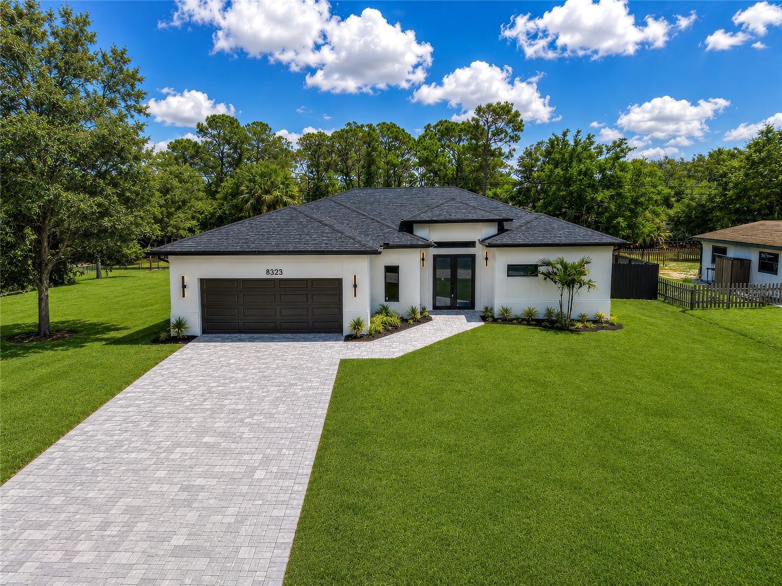 Welcome to your Florida dream home! This stunning semi-custom new construction offers 3 bedrooms, 2 bathrooms, plus a spacious den that can easily serve as a home office, guest room, or 4th bedroom. The thoughtfully designed open floor plan creates a bright and inviting living space, perfect for entertaining and everyday living. Designed with modern elegance and comfort in mind, this home features soaring high ceilings, luxury vinyl flooring throughout, impact-resistant windows and doors, quartz countertops, oversized custom cabinetry, designer lighting, and beautifully appointed bathrooms with today’s most sought-after finishes. Step outside to your private backyard oasis featuring a sparkling pool, covered tiled lanai, extended paver deck, and a fully fenced backyard, providing privacy, security, and the perfect space for family gatherings, pets, and outdoor enjoyment. Additional highlights include a modern energy-efficient A/C system, a spacious 2-car garage, and premium craftsmanship throughout. Located in one of North Port’s most desirable areas, this property is NOT in a flood zone and has NO HOA or CDD fees. Conveniently situated near I-75, shopping, restaurants, medical facilities, Warm Mineral Springs, parks, and everything Southwest Florida has to share. Whether you’re searching for your forever home, a seasonal retreat, or an investment opportunity, this exceptional property offers the perfect combination of luxury, comfort, and location. Enjoy the peace and tranquility of Florida living while being just minutes from all the conveniences you need. Schedule your private showing today and discover the lifestyle you’ve been dreaming of.