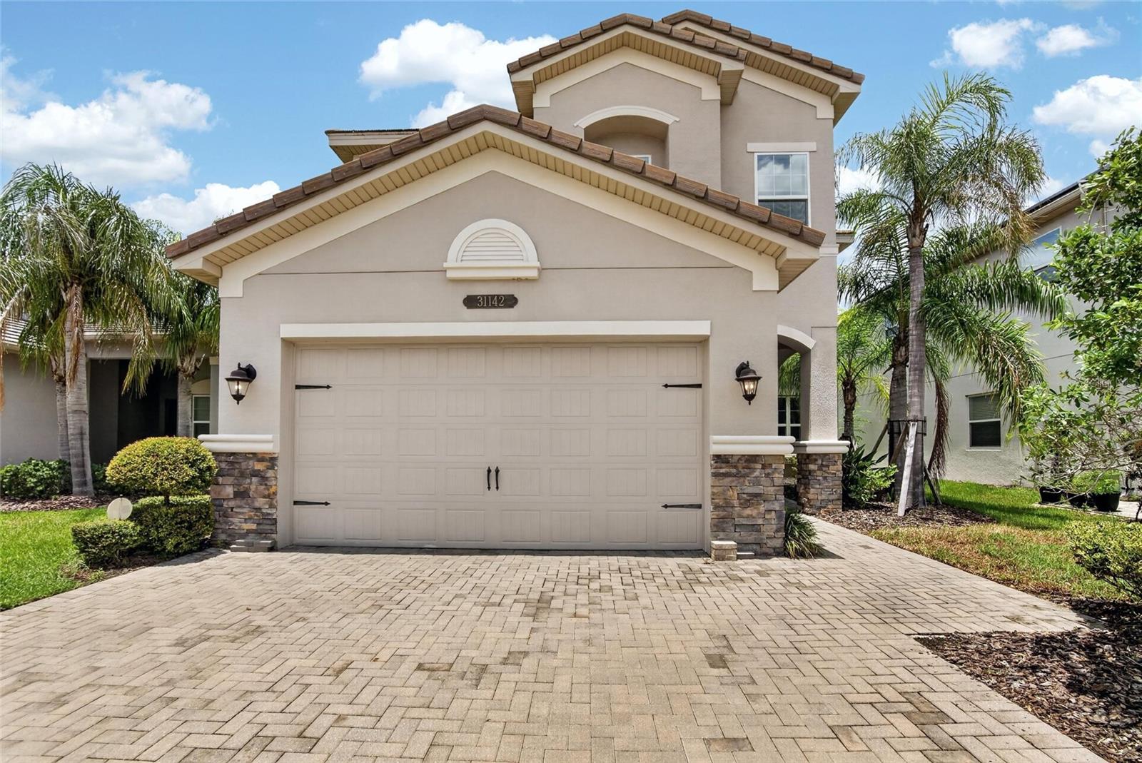 ? Price Below Market | Premium Lake View | 5BR + Loft | Screened Lanai | Gated Resort Community. Welcome to this exceptional 5-bedroom, 4-bathroom lakefront residence offering 3,381 square feet of thoughtfully designed living space in the highly sought-after gated community of The Ridge at Wiregrass Ranch.

Perfectly positioned on a premium waterfront homesite, this home showcases breathtaking lake views from the spacious covered and screened lanai, creating the ideal setting for morning coffee, outdoor dining, or relaxing Florida sunsets.

Inside, you'll find an open-concept layout designed for both everyday living and entertaining. The gourmet kitchen features quartz countertops, abundant cabinetry, stainless steel appliances, a large center island, and overlooks the expansive family room with oversized sliding glass doors that seamlessly connect indoor and outdoor living.

A desirable first-floor guest suite with a full bath provides privacy for visitors or multi-generational living. Upstairs, a generous loft offers endless flexibility as a media room, playroom, or home office. The luxurious owner's suite includes dual walk-in closets and a spa-inspired ensuite bath with dual vanities, a soaking tub, and a separate walk-in shower.

Additional highlights include a 2-car garage, abundant storage, energy-efficient construction, and a spacious laundry room.

Residents of The Ridge at Wiregrass Ranch enjoy resort-style amenities, including a spectacular clubhouse, beach-entry pool with waterslide, lap pool, fitness center, tennis courts, basketball courts, volleyball courts, playgrounds, and scenic walking trails. Conveniently located just minutes from Wiregrass Mall, Tampa Premium Outlets, AdventHealth, top-rated schools, restaurants, and I-75.

Offered at an exceptional value below current market pricing, this is a rare opportunity to own one of the community's most desirable floor plans with beautiful lake views. Schedule your private showing today!