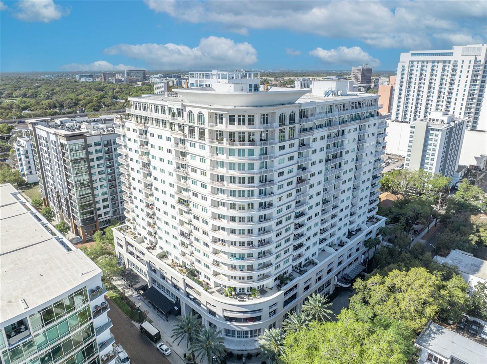 Exquisitely remodeled and thoughtfully curated, this Penthouse at 100 S Eola Dr PH 116, tucked in the heart of highly coveted South Eola, offers the perfect blend of refined luxury, privacy, and vibrant, walkable downtown living. Expansive windows bathe the open living and dining areas in soft natural light while showcasing postcard-worthy views of Lake Eola and a dramatic, glittering city skyline. The gourmet chef’s kitchen is meticulously designed for both everyday cooking and effortless entertaining, featuring sleek cabinetry, striking white quartz countertops, built-in appliances, and a generous waterfall island that flows seamlessly into the main living space for easy gathering. The spacious primary suite feels like a serene private retreat with a spa-inspired bath, oversized glass-enclosed shower, elegant finishes, and generous custom closet space. An inviting additional bedroom suite is ideal for overnight guests, extended family, or a dedicated, polished home office, offering flexibility without compromising comfort or style. The balcony creates an easy indoor-outdoor lifestyle, perfect for quiet morning coffee, al fresco dining, or evening cocktails overlooking the twinkling city lights and lakeside panorama. Located in a sought-after, boutique, concierge-style building, this penthouse provides secure entry, 2 reserved garage parking spaces, and resort-style amenities such as a sparkling pool, a well-equipped fitness center, a stylish resident lounge, and a summer kitchen on the pool deck for effortless entertaining. Step outside your front door to enjoy Lake Eola Park, Sunday farmers markets, neighborhood cafés, chef-driven fine dining, wine bars, and vibrant nightlife, all just moments away along tree-lined, brick-paved streets. With its contemporary design, generous square footage, and unmatched high-end finishes, this supremely walkable South Eola address presents an exceptional opportunity for buyers seeking sophisticated, upscale urban living in the heart of downtown Orlando. Additional amenities include Full-time Front Desk Concierge and Building Operations Team, Full-time Manager, Five High-Speed Elevators, 14 Guest Parking Spaces and 2 EV charging stations.