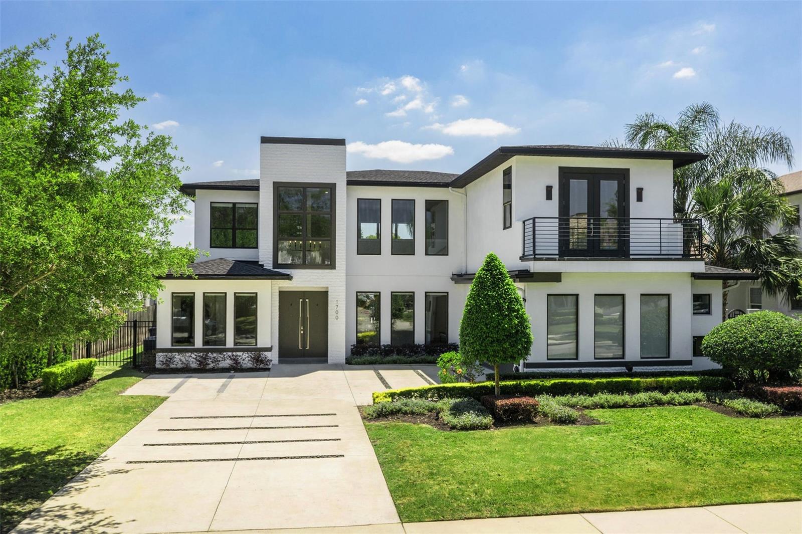 One lucky Buyer's gain is this Seller's bittersweet goodbye. A job relocation has these homeowners leaving behind a home they absolutely love, and now, you can make 1700 Palm Ave. yours! Modern sophistication and everyday functionality come together seamlessly in this exceptional Winter Park residence.
With 3,770 square feet of thoughtfully designed living space, this 4-bedroom, 4.1-bath home offers a fantastic floorplan featuring a first-floor primary suite, private office, and a striking two-story great room filled with soft natural light from the south-facing backyard.
Upstairs, a generous loft/bonus room accompanies three en-suite bedrooms, including a second suite designed as an alternate primary, complete with a private balcony, dual walk-in closets, and a dedicated water closet. The smart three-way split bedroom configuration enhances privacy and flexibility, while the first-floor primary suite features two large walk-in closets and a stackable washer and dryer for added convenience.
The open-concept layout flows effortlessly to the covered lanai, complete with electronic roll-down screens, two beverage refrigerators, and a gas grill—overlooking a sleek saltwater pool framed by gray and white marble pavers. Tall sliding glass doors stack to create a seamless indoor-outdoor living experience, perfect for entertaining. Lush, mature podocarpus hedges and Japanese blueberry trees line the perimeter, offering a private and polished backdrop.
The chef’s kitchen is outfitted with top-of-the-line Viking appliances, a gas cooktop, quartz countertops, and a walk-in pantry. A spacious island with a beverage fridge and generous storage complements the adjacent dining area, which comfortably seats eight, with room to expand for larger gatherings. Custom electronic roller shades add privacy and a clean, modern aesthetic, electronic/rechargeable blinds throughout the first floor and matching manual blinds upstairs. 
Wide-plank oak floors extend throughout the main level and up the architectural floating staircase. The oversized garage is equally well-appointed, featuring two storage closets and a built-in rack system.
Ideally located just minutes from Winter Park’s renowned shops and dining on Park Avenue. The home is zoned for top-rated WP schools, including Winter Park High, Maitland Middle, and Lakemont Elementary.
Looking to join a tennis league or spend afternoons on the golf course? This home is surrounded by both public and private clubs for social and athletic enjoyment. 1700 Palm Ave. delivers fabulous living in one of Central Florida’s most coveted neighborhoods.