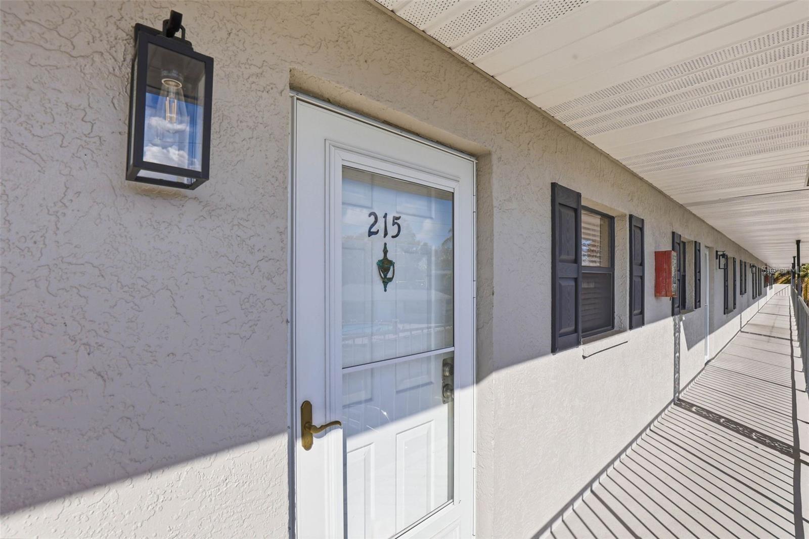 Welcome to this beautifully renovated 2-bedroom, 2-bathroom top-floor condo in the heart of Largo! High and dry with no history of flooding, this move-in-ready home is located in a meticulously maintained community featuring a new roof, freshly painted exterior, sparkling community pool, and tennis court with new fencing.

Inside, you'll find tasteful upgrades throughout, including luxury flooring, fresh interior paint, recessed lighting, new blinds, and ceiling fans in the living room and both bedrooms. The updated kitchen features granite countertops, stainless steel appliances, a premium dishwasher, garbage disposal, and a convenient under-sink water filtration system. A full-view glass door with a retractable screen fills the living space with natural light, while a built-in speaker system creates the perfect atmosphere for entertaining.

The spacious primary suite offers two large walk-in closets with custom shelving and shoe racks, an upgraded sliding glass door, and a beautifully renovated en-suite bath with granite countertops, a tiled walk-in shower, and a new medicine cabinet. The guest bathroom features granite countertops, a tiled tub surround, and a new exhaust fan.

Additional highlights include in-unit laundry washing and a association common area laundry area, and an unbeatable location just minutes from Gulf beaches, shopping, restaurants, parks, and all that Largo has to take in. Thirty-day minimum rentals are permitted, making this an excellent option for both full-time residents and seasonal owners.

Don't miss this exceptional opportunity—schedule your private showing today!
