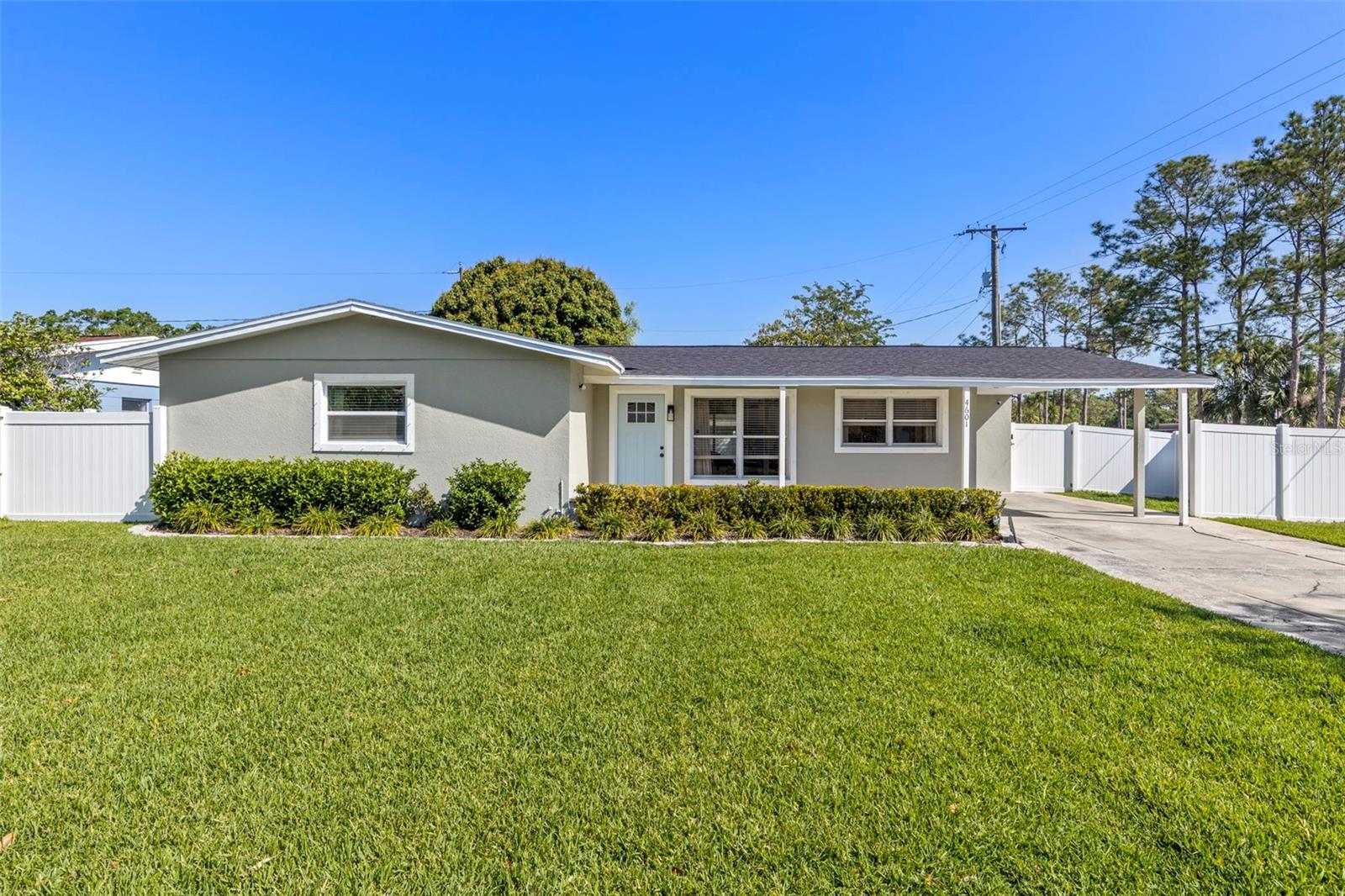 Welcome to this beautifully renovated 3 bedroom 2 bathroom home situated on a sought-after corner lot in the heart of South Tampa! With no flooding history during ownership and major updates including a 2023 Roof, 2023 HVAC system, and 2024 attic ductwork and insulation, this move-in-ready home offers both style and peace of mind. Great curb appeal starts with a spacious two-car driveway, covered carport, and fresh landscaping. The front, side, and backyard have all been cleared, re-sodded, and outfitted with a newer irrigation system, giving the home a clean, well-maintained look and plenty of outdoor space to enjoy. Inside, you'll find a bright, open-concept floor plan filled with natural light and enhanced by oak luxury vinyl flooring throughout. The stunning kitchen serves as the centerpiece of the home, featuring oversized waterfall quartz countertops, solid wood cabinetry, and premium stainless steel appliances. Thoughtful upgrades continue throughout with updated trim, doors, designer lighting, ceiling fans, and modern hardware. The spacious primary suite offers a walk-in closet and a beautifully updated ensuite bathroom complete with a large vanity and walk-in shower. Two additional bedrooms provide generous accommodations and share a fully renovated guest bathroom with contemporary finishes. Outside, the enclosed patio creates the perfect space for morning coffee, working from home, or relaxing in the evenings. The fully fenced backyard, featuring newer vinyl fencing, provides plenty of room for a pool, home addition, or future expansion while still leaving space to enjoy the outdoors. Talk about LOCATION! This home is perfectly situated just minutes from the Selmon Expressway, Gandy Boulevard, Westshore, Bayshore Boulevard, MacDill Air Force Base, Tampa International Airport, Downtown Tampa, and Downtown St. Petersburg. Located in the heart of South Tampa, you'll love the convenience of being less than 20 minutes from both Downtown Tampa and Downtown St. Pete. Grocery stores, restaurants, shopping, and entertainment are all just minutes away, making everyday life easy. It's tough to find a location that offers this much accessibility to everything Tampa Bay has to enjoy. Don't miss this opportunity to own a beautifully updated home in one of Tampa's most desirable neighborhoods. Schedule your tour today!