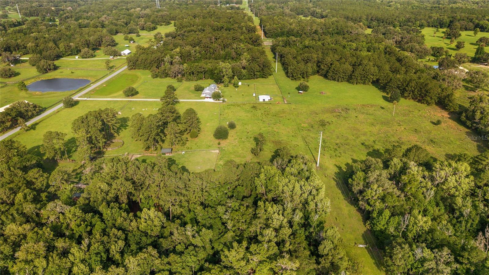 Welcome to one of Williston's most coveted corridors, where rolling pastures meet the legacy of Florida's legendary horse country. This pristine 10-acre parcel offers the rare combination of high, dry ground and a peaceful rural setting surrounded by beautifully maintained equestrian estates. Whether you envision a custom dream home, a private barn, or both, this blank canvas is ready to bring your vision to life.

Nestled among established horse farms and grand rural estates, the property enjoys natural privacy while remaining part of a distinguished agricultural community. The elevated, well-drained topography means no flood zone worries, just clean, buildable land with room to roam, ride, and grow.

Location is everything, and this parcel delivers. You're just minutes from the charming Town of Williston, with its local shops, dining, and community events. Gainesville, home to the University of Florida, UF Health Shands Hospital, a vibrant arts scene, and all major amenities is an easy 30-minute commute. Ocala's World Equestrian Center and downtown amenities are equally close, making this an ideal retreat for equestrians and professionals alike.

Whether you're looking to build your forever home, establish a boutique horse operation, or simply invest in one of North Central Florida's most desirable agricultural areas, this property is a rare find. Sites like this, high, dry, and surrounded by beauty don't last long in Williston's sought-after landscape.