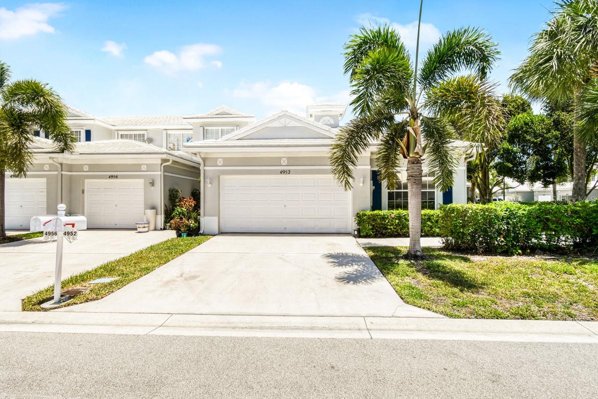 Prepare to be impressed by this beautifully updated and meticulously maintained end-unit villa in the highly sought-after gated community of Lantern Key. Outstanding curb appeal welcomes you with a freshly painted exterior, lush landscaping, and the added privacy of an end-unit location complete with a spacious front yard. A rare and highly desirable feature, this villa also offers an attached two-car garage—an exceptional find for this style of home.

Step inside to discover a bright, open-concept floor plan enhanced by custom interior paint and abundant natural light. The beautifully updated kitchen features stylish cabinetry, granite countertops, and premium stainless steel appliances, making meal preparation and entertaining effortless. The spacious primary suite serves as a private retreat with a beautifully remodeled walk-in shower showcasing contemporary tilework and upscale fixtures.

Enjoy Florida living year-round from the private patio, perfect for relaxing or entertaining guests. Residents of Lantern Key enjoy outstanding community amenities, including a sparkling swimming pool, fitness center, clubhouse, playground, and sidewalks throughout the neighborhood. The monthly HOA fee provides exceptional value by covering basic cable, internet, trash service, gated security, and extensive exterior maintenance, including lawn care, tree trimming, roof cleaning, and common area upkeep.

Ideally located near premier shopping, dining, parks, outdoor recreation, and major highways, this move-in-ready home offers the perfect blend of comfort, convenience, and low-maintenance living. Absolutely turn-key and ready for its next owner!