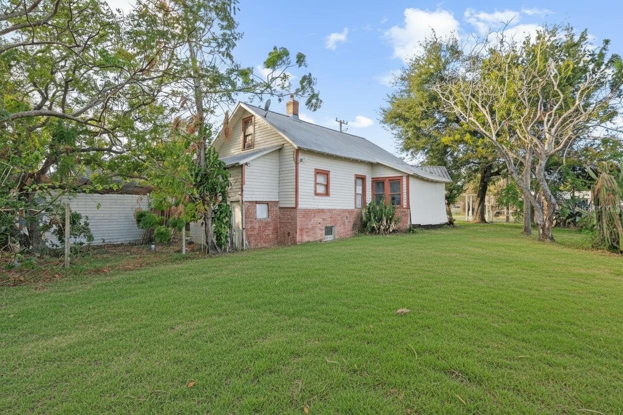 This B-1 commercial-zoned corner property has rare flexibility in one of Minneola’s most desirable corridors ! Located at 201 West Washington Street - Just 1/5 of a mile from Lake Minneola within an easy sidewalk stroll. Benefit from constant daily traffic with thousands of cars passing by, making this an ideal location for businesses that rely on visibility and drive-by exposure. The building requires renovation and is positioned as a value-add opportunity in one of Minneola’s most desirable locations.

The home features a huge back and side yard, providing ample outdoor space. A separate entrance to the basement supports multi-generational living, while an additional side entrance near the attic staircase provides flexibility for a private living area for extended family.

The structure contains approximately 945 square feet of finished interior living area, plus additional usable square footage beyond the recorded total, including a covered porch, attic square footage, and a fully walkable basement—a rare feature in Florida that provides functional space not commonly found in the area. As a result, the overall usable space is larger than the recorded square footage.

The property also features a fenced yard and a large interior staircase leading to the attic, offering strong potential for storage or future build-out.

Situated on a 6,720 sq ft corner lot, the property is located less than a ¼-mile sidewalk walk to the well-known Minneola Tiki Bar & Restaurant and approximately 0.3 miles from the South Lake Trail. The house is also a 0.4 mile walk from the brand new highly rates Minneola library that opened in October 2025. The site is also just a few homes from Lake Minneola and within close proximity to downtown amenities. The house is on city of Minneola water, so no worry of a septic of drain field. 

This is an incredible location with long-term upside, well suited for buyers seeking zoning flexibility, character, and proximity to lakefront recreation and established downtown destinations within the corridor.