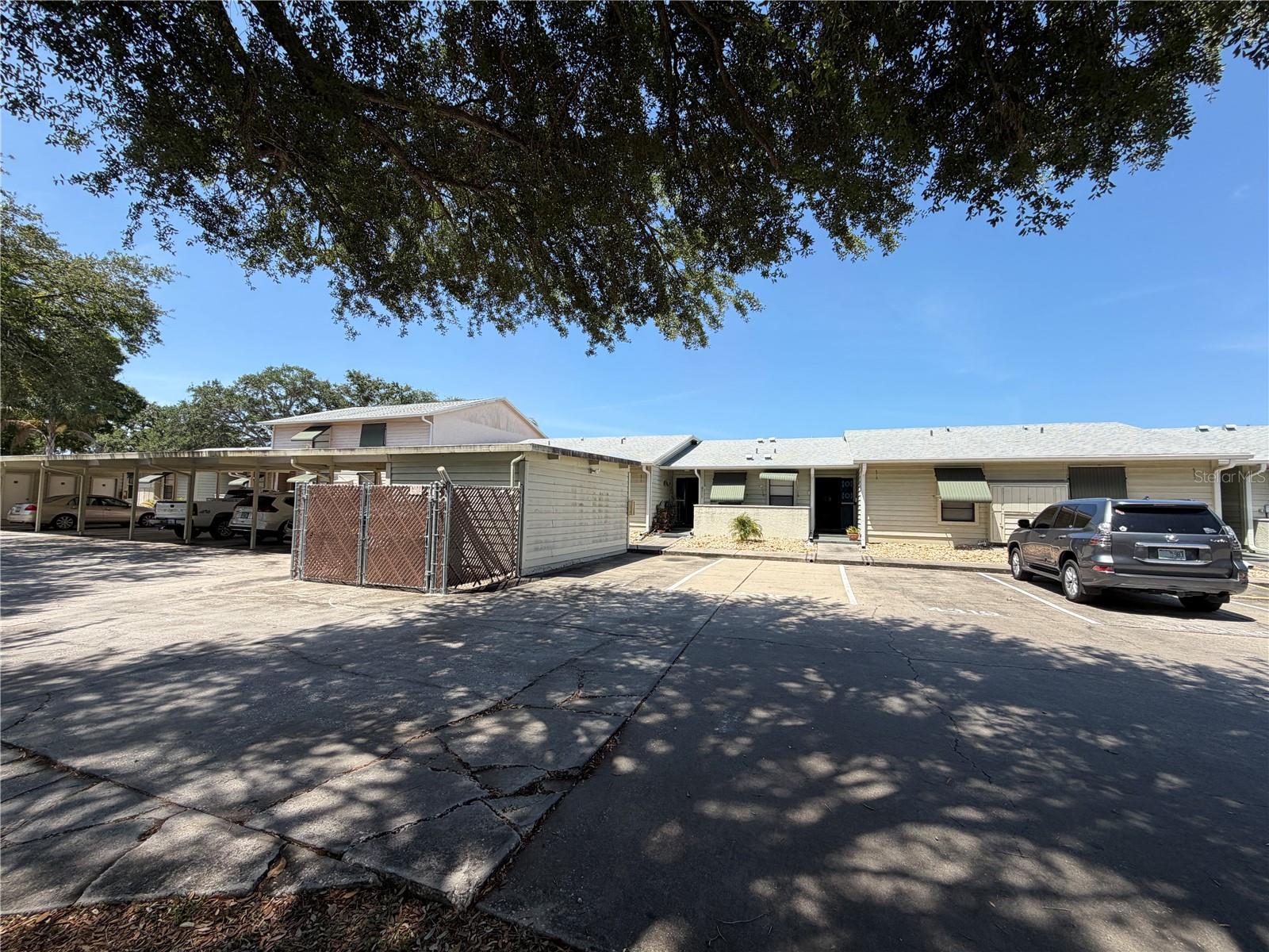 Welcome to River Side Village Condominiums! This spacious 2-bedroom, 2-bathroom home offers nearly 1,400 square feet of comfortable living space, perfect for full-time living or a seasonal retreat. Enjoy the convenience of two parking spaces, including one covered spot located just steps from your front door, along with a private, locking storage area adjacent to your assigned parking. The well-appointed kitchen features ample cabinet and countertop space, ideal for both everyday use and entertaining. The HVAC system was replaced just last year, providing peace of mind and energy efficiency. Residents benefit from low HOA fees that cover exterior maintenance, including the roof—making for truly low-maintenance living. Cash or conventional financing only. Ideally located just minutes from shopping, dining, and everyday essentials, with easy access to the Suncoast Parkway for a smooth commute. Whether you're searching for a primary residence or a seasonal getaway, this charming condo offers the perfect blend of comfort, convenience, and community. Schedule your private showing today and experience the lifestyle you deserve!