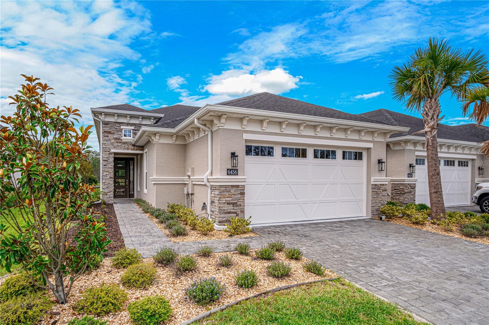 Welcome to effortless Florida living in the highly sought-after Woodhaven community of Port Orange! Built in 2024 and meticulously maintained, this stunning 2-bedroom, 2-bath townhome—with a dedicated office or possible 3rd bedroom—offers the perfect blend of modern luxury, comfort, and convenience. From the moment you arrive, you'll be greeted by an elegant paver driveway and beautiful curb appeal. Inside, soaring ceilings, oversized doors, and an open-concept design create a bright and spacious atmosphere. The chef-inspired kitchen features quartz countertops, solid wood cabinetry, a designer backsplash, and a full suite of GE stainless steel appliances, making it ideal for both everyday living and entertaining. Retreat to the screened Florida room and enjoy peaceful preserve views while taking in the sights of native Florida wildlife right from your backyard. The epoxy-coated garage floor adds both style and durability, while the home's like-new condition provides true peace of mind. Residents of Woodhaven enjoy access to exceptional community amenities and a prime location just minutes from Cypress Head Golf Club, The Pavilion at Port Orange, shopping, dining, entertainment, and convenient I-95 access for easy commuting. Whether you're looking for a low-maintenance primary residence, seasonal retreat, or investment opportunity, this move-in-ready home offers the lifestyle you've been searching for.