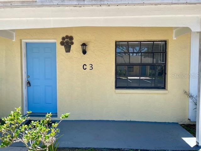Nestled in a quiet, well-maintained community just minutes from U.S. Highway 19 and vibrant downtown Dunedin, this charming villa offers both convenience and comfort. Tucked away near the rear of the property, the villa features the added benefit of dedicated parking directly in front of the unit. The bright, thoughtfully designed kitchen provides ample counter space and abundant storage, making meal preparation a breeze. The spacious open-concept living and dining area creates an inviting atmosphere for everyday living and entertaining.
Step through the sliding glass doors to your private screened lanai—an ideal spot to enjoy your morning coffee or unwind in the evening. For added convenience, the lanai includes washer and dryer hookups. The villa features two generously sized bedrooms, each offering large closets for plenty of storage. The full bathroom includes a tub and shower combination, while a separate half bath provides added convenience for guests. Ideally situated between Dunedin and Clearwater, you'll enjoy easy access to a wide variety of shopping, dining, parks, and entertainment options. Trash pickup and community landscaping maintenance included. One year lease. No pets please.