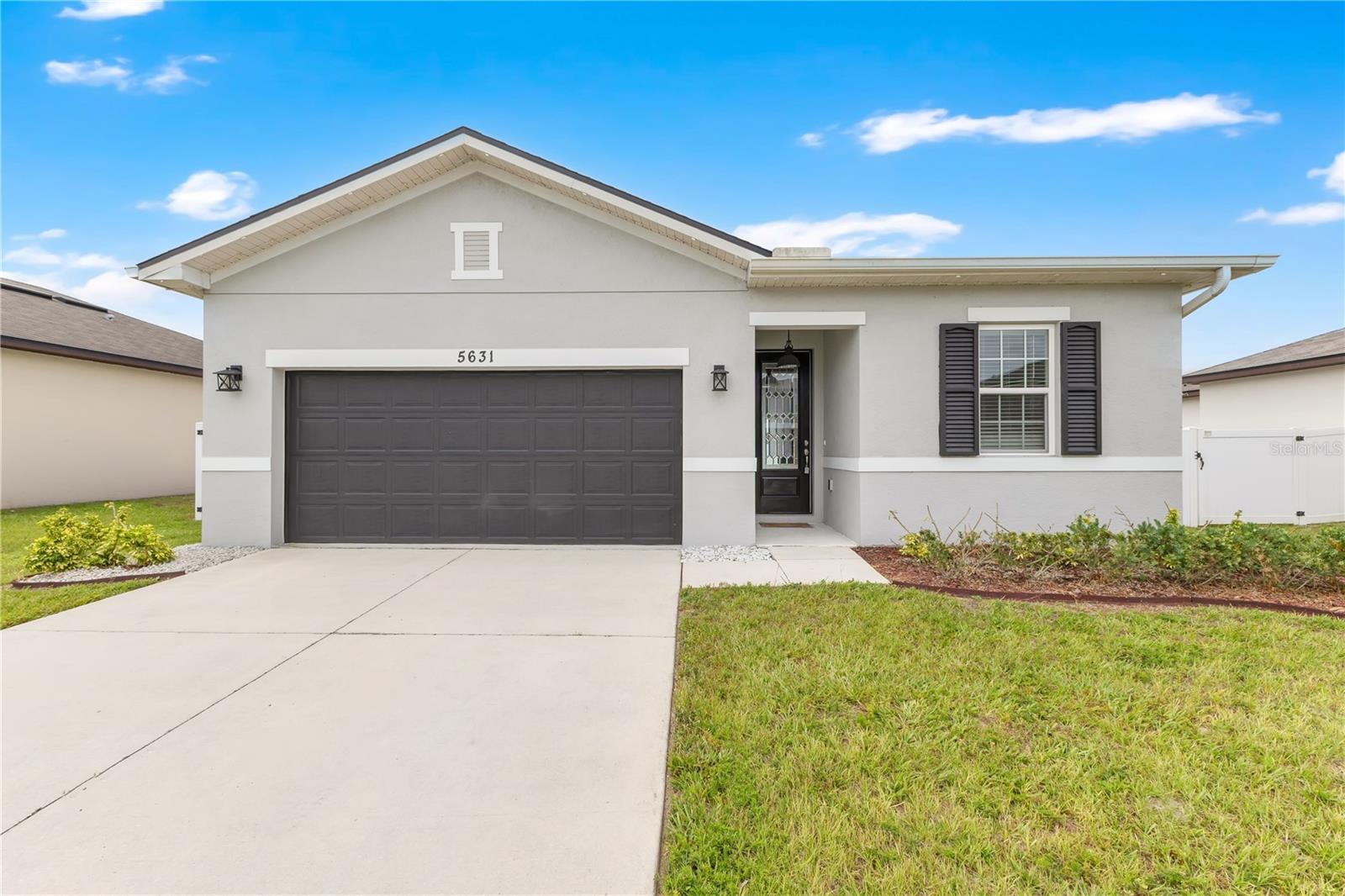 Located in the desirable Estates of Westerly community, this 4-bedroom, 2-bathroom home offers a thoughtfully designed split-bedroom floor plan, spacious living areas, and modern finishes throughout. The inviting layout provides both privacy and functionality, making it ideal for everyday living and entertaining alike.

Upon entering the home, you'll find a secondary bedroom near the front of the property, creating a convenient space for guests, a home office, or flexible use. The entryway then opens into the heart of the home, where the kitchen, dining area, and living room come together in a bright, open-concept design.

The kitchen is equipped with granite countertops, stainless steel appliances, abundant cabinetry, a pantry, and a large center island with seating that overlooks the main living and dining areas. The open layout creates a seamless flow throughout the home while large sliding glass doors bring in natural light and provide direct access to the covered lanai and backyard.

Privately situated at the rear of the home, the primary suite offers generous space along with a large walk-in closet and an ensuite bathroom featuring dual vanities and a spacious walk-in shower. Two additional bedrooms and a full bathroom are positioned on the opposite side of the home, providing a comfortable layout for family and guests.

Step outside to enjoy a covered lanai overlooking a fully fenced backyard highlighted by an expansive custom paver patio, creating an ideal setting for outdoor dining, entertaining, or relaxing. The backyard also features a storage shed, offering additional space for tools, equipment, and seasonal items. The property is equipped with solar panels, helping provide energy efficiency and potential utility savings.

Residents of Estates of Westerly enjoy access to a community pool and additional neighborhood amenities, enhancing the overall lifestyle and convenience of the community.

Conveniently located near Lake Nona, Medical City, Narcoossee Road, major highways, shopping, dining, and everyday conveniences, this home combines modern comfort, functional design, energy efficiency, and an excellent Central Florida location.