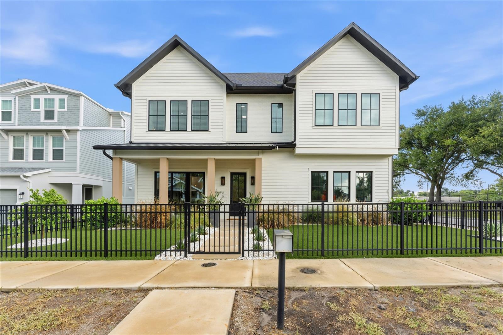 Completed in 2023, this exceptional semi-detached single-family residence offers a rare opportunity to enjoy modern design, quality craftsmanship, and the convenience of one of Tampa's most sought-after locations. Just moments from Armature Works, the Tampa Riverwalk, Downtown, Water Street, acclaimed restaurants, breweries, and entertainment, you'll enjoy the energy of the city while coming home to a space designed for comfort, privacy, and everyday luxury.
From the moment you step inside, soaring 11-foot ceilings, oversized 8-foot doors, and abundant natural light create an immediate sense of openness and sophistication. The thoughtfully designed open-concept floor plan was created for both effortless entertaining and comfortable daily living, seamlessly connecting the living, dining, and kitchen spaces.
At the heart of the home is a chef-inspired kitchen featuring quartz countertops, premium cabinetry, a Thor gas range, pot filler, smart range hood, and an oversized island that naturally becomes the gathering place for family and friends.
Upstairs, a spacious loft offers endless flexibility as a home office, media room, fitness space, or additional living area. The primary suite serves as a private retreat with a spa-inspired bath complete with a soaking tub, oversized walk-in shower, dual vanities, and a generous walk-in closet. Each additional bedroom features its own en-suite bathroom, providing comfort and privacy for family and guests alike.
Outside, enjoy the rare combination of a private fenced yard, an oversized two-car garage, and the freedom of no HOA—features that are increasingly difficult to find in newer construction.
Whether you're hosting dinner with friends, enjoying a quiet evening at home, or taking advantage of everything nearby, this residence offers a lifestyle that's as impressive as the home itself. Modern construction, timeless finishes, and an exceptional location come together to create a property that truly stands apart.
Schedule your private showing today and experience firsthand what makes this home so special.