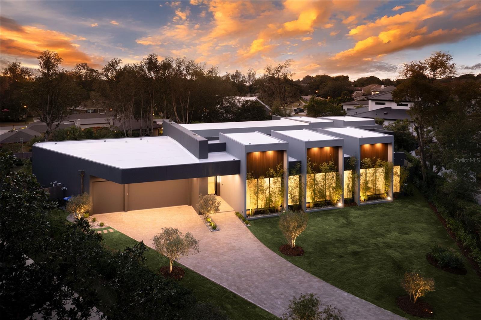 Unparalleled Luxury & International Design in Prestigious Bay Hill, Dr Phillips 
This newly developed, architecturally unique residence in Bay Hill is not merely a house—it is an iconic masterpiece and an internationally inspired designer art piece that redefines the zenith of luxury living in Orlando.

Your grand experience begins by passing through 10-foot modern pivot doors that open like magnificent stage curtains, revealing the home's spectacular scale: Italian hardwood planks grounded below soaring 20-foot ceilings. Sunlight floods the space, bathing a stunning indoor garden oasis with live mini olive trees—a breathtaking, bespoke element that sets an extraordinary tone for the entire estate.

The gourmet kitchen is a true chef’s fantasy, taking center stage with a full suite of Dacor high-end stainless-steel appliances, a sleek oversize waterfall island of impeccable design, and a discreet, built-in Zephyr wine refrigerator. Every curated detail whispers uncompromising sophistication.

Indulge in spa-quality opulence within the bathrooms, featuring exclusive Hansgrohe Axor fixtures and award-winning Duravit toilets. The master sanctuary is a haven of tranquility, complete with a double glass shower and a custom, hand-finished Dado soaking bath designed for ultimate rejuvenation.

Seamless, sophisticated living is achieved through massive sliding doors that effortlessly draw the interior and exterior together. Step out to a breathtaking backyard retreat boasting a dramatic 65-foot shimmering pool, a chic pool deck paved in luxurious Amazon green limestone tiles, and a professional-grade Summerset summer kitchen—perfectly appointed for grand-scale entertaining.

Sited within the ultra-exclusive Bay Hill community, known globally for its championship golf course and the yearly PGA Tournament, this estate places you moments from the world-class dining of Restaurant Row, luxury shopping, and Orlando’s renowned theme parks.

This is more than a property; it is an enduring work of art. An iconic masterpiece awaits. Contact us now to arrange your confidential private showing and experience its allure firsthand.