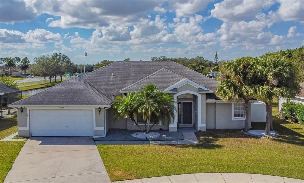Beautiful home in gated Springlake Village, with breathtaking lake view.  An updated 4 bedroom/2 bath home featuring a spacious open design with vaulted ceiling, great room, dining room, separate dinette area and extended lanai fully screened enclosed. Kitchen overlooks the great room and home has wood grain tile floors throughout with the exception of the master bedroom which offers engineered hardwood. Master bath features dual sinks, garden tub with jets, two walk in closets & a seamless glass shower enclosure. Freshly painted interior walls, 5" baseboards & tall three pane sliding glass door. New A/C installed in 2015. Rear lanai is spacious enough for outdoor parties, with spectacular water view. Oversized back yard to enjoy, two car garage & seamless gutters on the roof. Community amenities include Swimming pool, fitness center, tennis courts, shuffle board, playground & recreation center. Conveniently located near Lake Nona Medical Center, the Orlando International Airport, Austin Tindall Regional Park & easy access to the 417 Expressway.