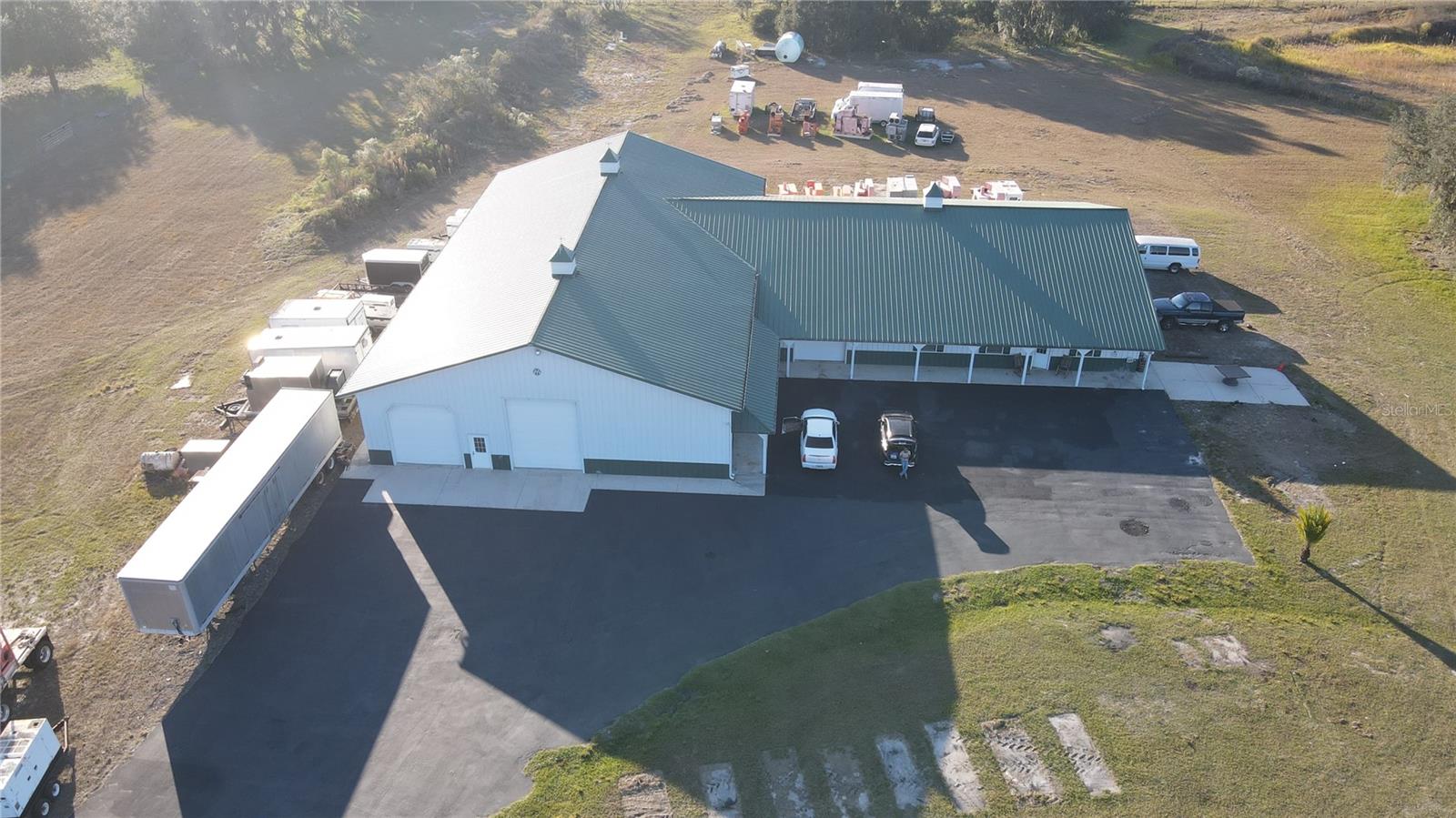 This unique property is a compound/farm, registered as an agricultural property. This property also has a Motorcross track that can be re-established with the county. Two addresses are associated with the property. The second address is 7221 SW 55TH ST. Bushnell, FL

Distinguished Features:
    •    Sweeping Acreage & Idyllic Natural Assets:
Sprawled over 68.75 pristine acres—an inviting venue for avid hunters—and a serene 4.45-acre lake. 1.7 miles of dedicated Motocross track. Prospective buyers may secure a special-use permit for this unique amenity, or opt to have the track flattened to better suit their personal vision.
The property is also zoned to be redeveloped into 5-acre parcels that can be built on, if the new owner wishes. 
    •    Two single-family residences encompassing 11,821 square feet of combined living space with elegant outdoor Living are on the property, along with a 7,000+ sq. ft. Morton pole barn.  
    •    Primary Residence:
The first SFH is constructed of block with a metal roof. This home features 2 bedrooms and 2 bathrooms, accentuated by vaulted ceilings in the living, kitchen, and dining areas. The inviting porch area further enhances the living experience, providing a tranquil space to savor the scenic surroundings.
The second SFH is constructed of metal siding, and a metal roof. This home features 4 bedrooms, 2 full bathrooms, and a half bathroom. Encompassing vaulted ceilings throughout the main living areas, providing an open, airy feel to the space. 
    •    Morton Barn & Warehouse:
Exemplifying top-tier craftsmanship, the barn is a Morton masterpiece designed with hurricane-resistant construction and a sleek metal roof. Offering 7,000 square feet of meticulously organized warehouse space. The warehouse area is artfully segmented into four distinct areas, featuring:
    •    Five generous RV garage bays situated on the largest sections flanking both sides,
    •    Additional garage bays and a dedicated storage area,
    •    An expansive porch that mirrors the outdoor area of the primary home.
    •    Exclusive Recreational Opportunities:

Owner is open to owner financing with 35% down at full asking price.