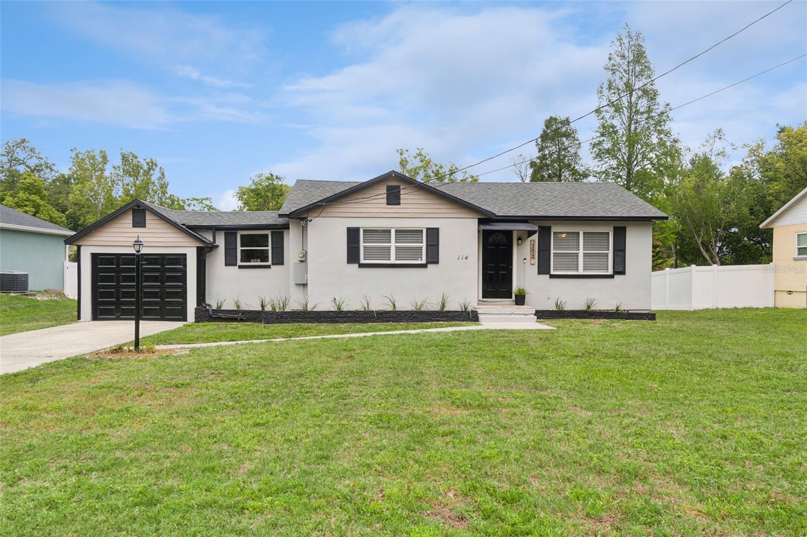 Picture-perfect 2/1 with additional flex room and inside utitlity room on 1/4 acre. So much on this well-loved home is NEWER! Newer roof, septic & drainfield, AC and ductwork, vinyl flooring throughout the home, doors, trim, baseboards, Levelor blinds, lighting & fans. Stepping in, you'll appreciate the ight and bright open floor plan and neutral paint throughout. The large living room opens to a spacious dining area. The kitchen is fully remodeled with soft-close cabinetry, stylish subway tile backsplash, stainless steel appliances and granite counter tops. There is a flex room just off the kitchen that can used as a den, breakfast room or office. Both the primary and secondary bedrooms are spacious. The attractive shared bath has also been fully remodeled. The inside utility room is huge and affords plenty of storage space. The garage feaures freshly painted floors and a newer garage door. There is a roomy screened-in porch off the back overlooking the large back yard. This house is move in ready! Just bring your toothbrush! In a convenient location close to shopping and dining.