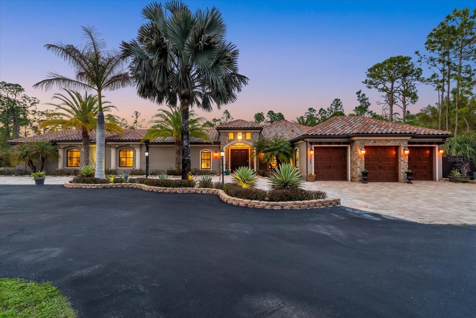 ASSUMABLE 2.99% $340,000 LOAN AVAILABLE: 3-acre estate home in North Port Estates featuring 6 bedrooms, 4.5 bathrooms, 3,802 square feet, and a rare courtyard pool design. Built in 2017 with exceptional attention to detail, this custom estate features a resort-style courtyard with a heated pool, covered lanai, and outdoor fireplace, creating seamless indoor-outdoor living ideal for both entertaining and everyday living. Inside, the home highlights an open-concept floor plan with high-end finishes, spacious living areas, and abundant natural light throughout. The chef’s kitchen flows into the main living space, making it perfect for hosting gatherings of any size. A standout feature of the property is the attached 2 Bedroom in-law suite, complete with its own private entrance, full kitchen, living room, 2 large bedrooms, and oversized closets, offering the perfect setup for multigenerational living, extended guests, or potential rental income. Situated on 3 private acres with a long driveway, mature landscaping, and peaceful surroundings, this property provides a rare combination of privacy, space, and flexibility with no HOA restrictions. Conveniently located just 2 miles from the new Sarasota Memorial Hospital North Port campus, minutes from the I-75 on-ramp for easy access to Sarasota, Venice, and Naples, and approximately 4 miles from Publix, shopping, and dining, this home offers the perfect balance of quiet estate living and everyday convenience. This is a rare opportunity to own a gated estate with acreage, a private guest suite, and a courtyard-style pool in one of North Port’s most desirable areas.
