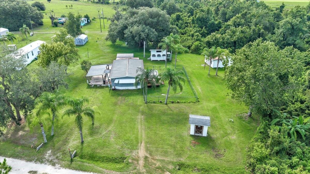 Welcome to your own slice of Florida country living! This beautifully maintained, turn-key 2-bedroom, 2-bathroom mobile home sits on nearly half an acre and is ready for you to move right in. Conveniently located just minutes from Arcadia and Punta Gorda, you will enjoy the perfect balance of peaceful living and easy access to shopping, dining, and everyday conveniences. Designed for both comfort and functionality, this property features two carports, a spacious deck that's perfect for relaxing or entertaining, a chicken coop for those seeking a homestead style, and a versatile shed currently used as a man cave that could easily serve as a workshop, hobby room, or additional storage. With plenty of outdoor space to enjoy and endless possibilities, this property is ideal as a primary residence, seasonal retreat, or investment opportunity. Don't miss your chance to make this charming property your own and schedule your private showing today!