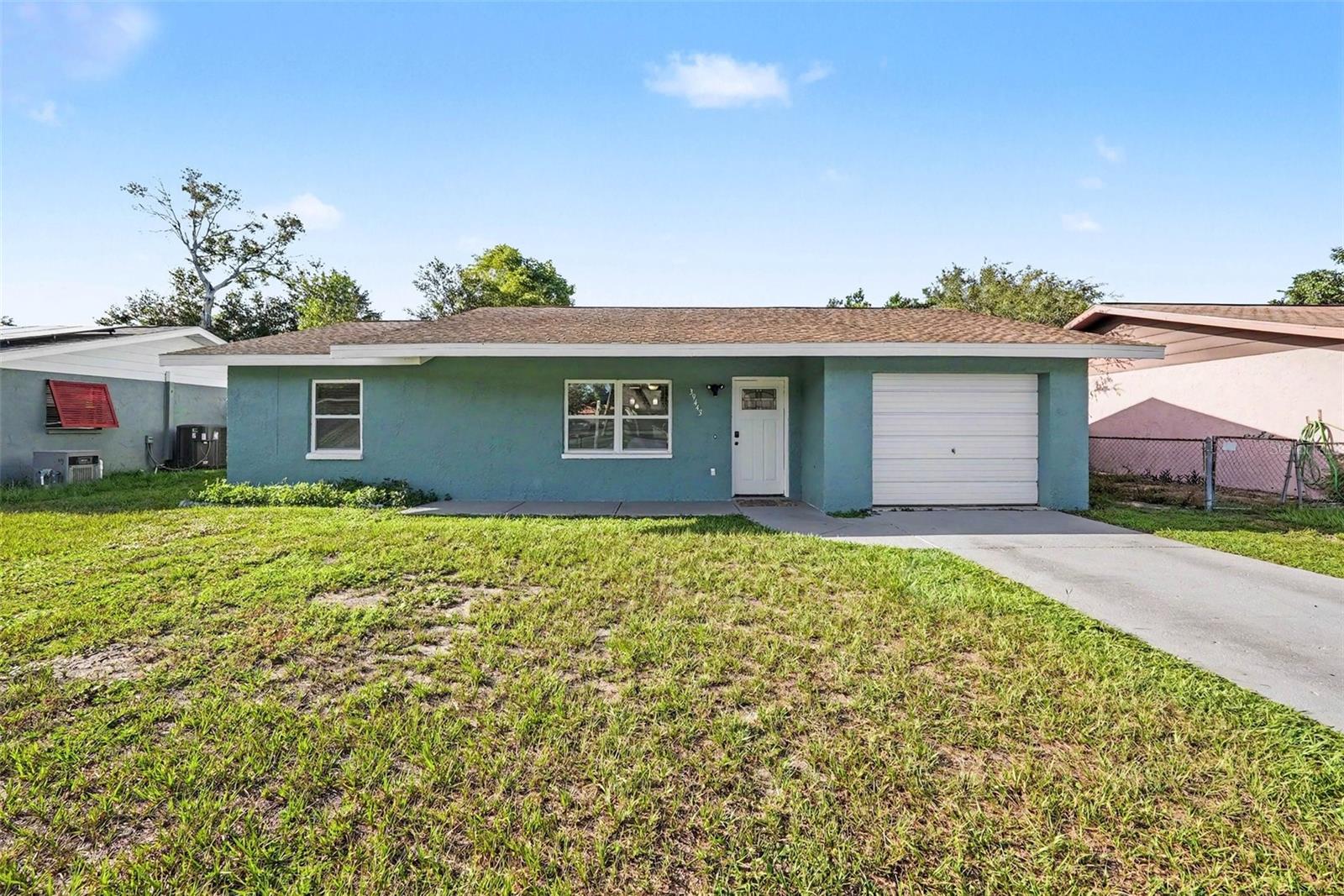 VA Loan Assumption Opportunity! IN-LAW suite! Unique opportunity for investors or traditional buyers! Single family home with an in-law suite, two kitchens and two living spaces. This is a comfortable and spacious 4 bed, 3 bath house in Zephyrhills in a quiet neighborhood. The home has an office space/den that can easily be converted into a 5th bedroom. Take advantage of the 2 full kitchens and 2 living room areas for cooking, relaxing, or entertaining. With a split floor plan, the home can easily serve as a multi-generational property and provides ample privacy whether you have family, roommates, or guests staying over. Adding to the convenience and comfort are 2 air handlers which condition separate parts of the home giving you the ability to intentionally customize and maintain steady temperature throughout the home. One AC is from 2024, and the other AC is from 2020. The roof is from 2017 and some windows were recently replaced, January 2026. The property is conveniently located minutes from the Wesley Chapel Wiregrass Mall, Tampa Premium Outlets, Crate, Pop Stroke, movie theaters, cigar bars, and many other types of shops, restaurants, and entertainment. The general area is highly desirable and a quick highway drive to the rest of Tampa Bay. Schedule a showing today and see for yourself. Your future home awaits.