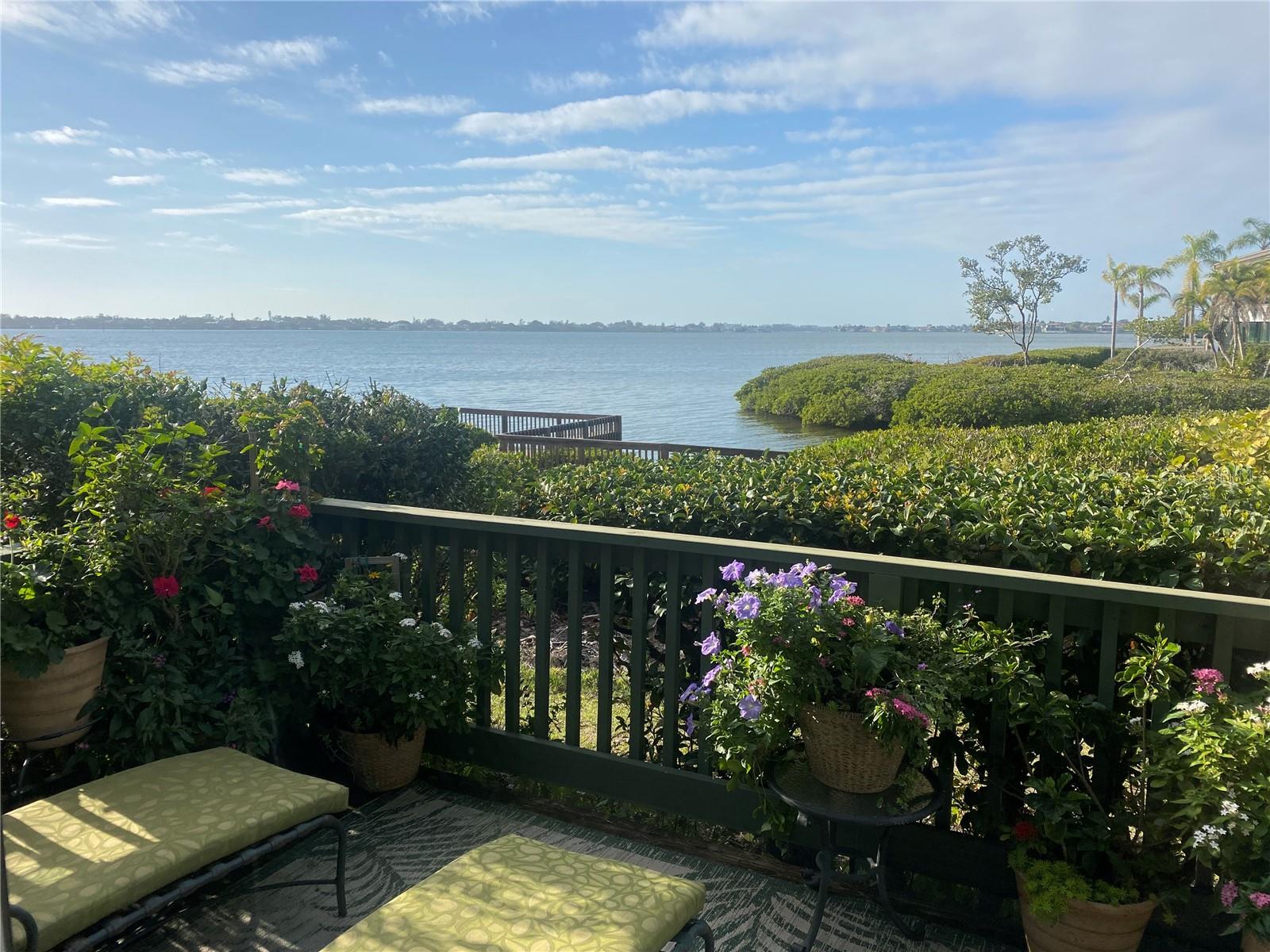 Fully renovated 2 bedroom/2 bath first floor waterfront condo overlooking Clower Creek and Sarasota Bay. Enjoy daily sightings of pelicans, egrets, and herons; manatees in the channel and sunsets.  This spacious two bedroom/two bath condo is filled with plenty of natural sunlight so that you can enjoy panoramic Sarasota Bay sunsets from your own private back deck.  Kitchen has been fully renovated with added extra storage and counter space.  As you drive past the gate, the lush tropical setting, fruit trees, bird watching and manatee sightings in the harbor will offer instant serenity and relaxation. Amenities include: art studio, woodworking shop, sculpting garden, 6 pools, yoga, tennis, pickleball, water aerobics, biking, new exercise room and kayak launches to name a few activities. Enjoy an impressive offering of performing arts, annual art show, cinema & culinary club, bridge and fiber arts club.