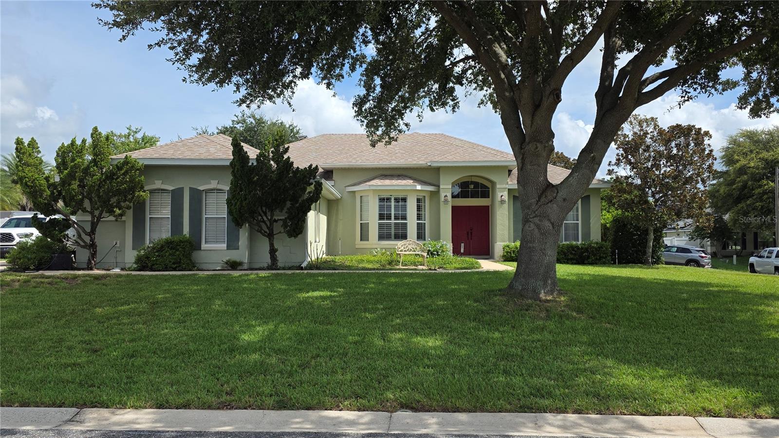 Welcome to a private Florida retreat, where beautifully updated interiors and an exceptional backyard create an ideal setting for comfort and entertaining. From the sparkling in-ground pool and dedicated outdoor cooking area to the warm bamboo
flooring and thoughtfully renovated living spaces, this Grand Island home offers standout features. A freshly painted exterior, attractive landscaping, elevated home site, and new entry lighting create impressive curb appeal before entering the double front doors. Inside, high ceilings and plantation-style shutter blinds enhance the welcoming atmosphere. Designed for everyday living and entertaining, the home offers both a formal dining room and a casual dining area adjoining the kitchen. The spacious kitchen serves as the heart of the home and features abundant cabinetry, a pantry, center island, breakfast bar, new countertops, and an updated backsplash. Whirlpool appliances include a range, built-in microwave, double oven, and double-door refrigerator with two ice makers. A convenient butler’s preparation area provides additional serving and storage space near the formal dining room, while the open layout keeps the kitchen connected to the main living area and backyard. The split-bedroom floor plan provides added privacy for the primary suite, which features dual closets and a spacious bathroom with a garden tub, separate shower, dual sinks, new granite countertops, and updated light
fixtures. The guest bathroom has been completely renovated with attractive shiplap detailing, new sink, and updated lighting. Two additional generously sized bedrooms provide comfortable accommodations for guests, a home office, hobby space, or everyday living. The interior laundry
room is conveniently located between the kitchen and garage, and the washer and dryer are included. An additional refrigerator in the garage also conveys with the property. The home features an electric water heater and an in-wall pest-control system that is currently inactive but
available for future activation. Outdoor living is a true highlight of the property. The private, fully fenced backyard offers an impressive amount of usable space and flexibility, with room for pets to enjoy, boat or recreational storage, a play area, additional outdoor seating, or a small garden. The in-ground swimming pool, built in 2019, is complemented by an outdoor shower, covered lanai, and dedicated grill shack, creating an ideal setting for poolside gatherings, outdoor cooking, and year-round entertaining. The spacious enclosed yard provides both privacy and convenience
while allowing future owners to make the outdoor space their own. The roof was also replaced in 2019, adding further value and peace of mind.

Located in the peaceful Grand Island area of Lake County, the home offers convenient access to Eustis for everyday shopping, restaurants, schools, medical services, and waterfront recreation. The property is also within easy reach of Tavares and historic Mount Dora, known for their lakefront parks, dining, shops, festivals, and small-town charm. Outdoor enthusiasts will appreciate the nearby Harris Chain of Lakes, with
opportunities for boating, fishing, kayaking, and enjoying the natural beauty of Central Florida. Combining a spacious interior, extensive updates, valuable included appliances, and an exceptional backyard entertainment area, this move-in-ready pool home offers a wonderful opportunity to
enjoy the relaxed Florida lifestyle.