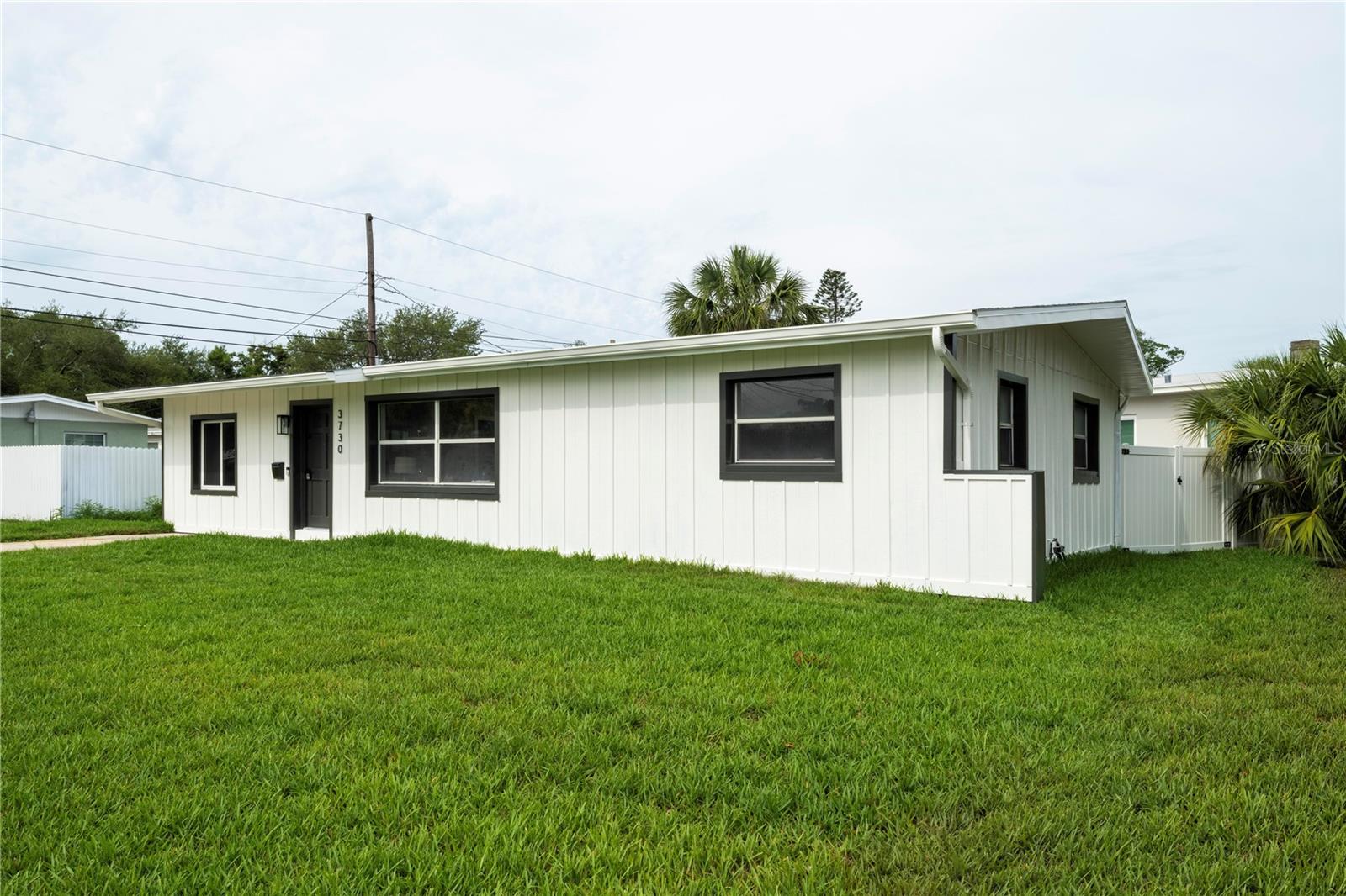 One or more photo(s) has been virtually staged. Stunningly reimagined Mid-Century Modern gem on a prime St. Petersburg corner lot! Having undergone a meticulous full cosmetic remodel, this 3-bedroom, 1-bathroom block home is the definition of turn-key Florida living. Step inside to discover an airy, open floor plan with plenty of natural light and gorgeous luxury vinyl plank flooring throughout. The spacious layout features an airy kitchen/dining combo boasting solid wood cabinets and sleek White Rajado marble countertops—an absolute dream for entertaining. Enjoy ultimate peace of mind with a brand-new roof (2025) and all new appliances (2026). Outside, the private yard is fully enclosed with premium vinyl fencing, creating a secure, tranquil oasis perfect for relaxation or pets. Location is everything! You are just a 3-minute drive to the waterfront at Abercrombie Park, Walter Fuller Dog Park, Publix, and Tyrone Square Mall. Plus, enjoy world-class local beaches in 15 minutes and vibrant downtown St. Petersburg in just 20 minutes. Don't miss this updated piece of paradise!