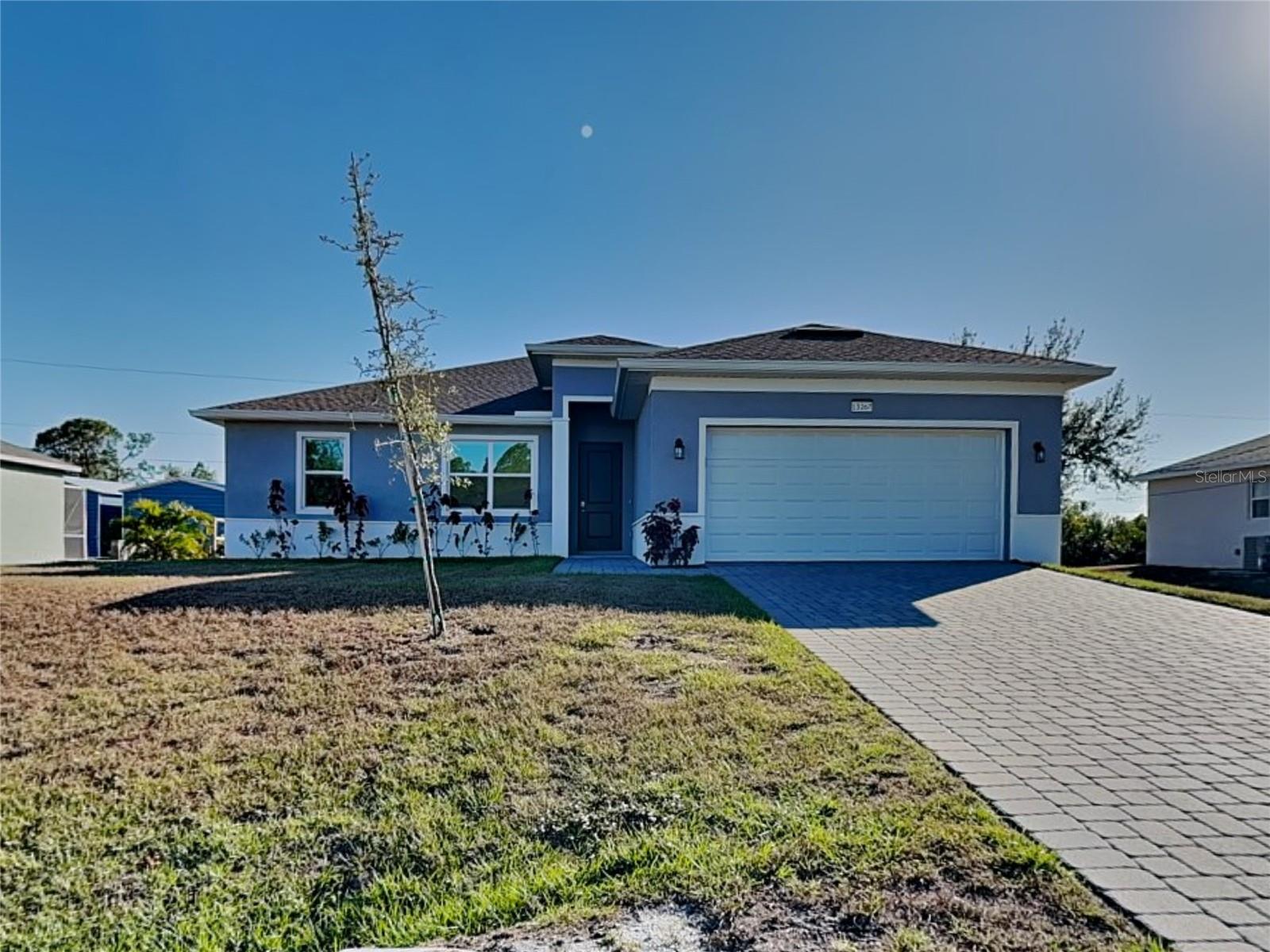 Under contract-accepting backup offers. Own this beautifully maintained 2025-built home in a quiet Port Charlotte neighborhood. This spacious 4-bedroom, 2-bath residence offers 1,914 square feet of modern, thoughtfully designed living space, complete with an attached 2-car garage and stylish finishes throughout. Step inside to an inviting open-concept layout featuring high ceilings, abundant natural light, and contemporary design. The beautiful kitchen is a true centerpiece, showcasing stainless steel appliances, granite countertops, a large center island, and ample cabinet space—perfect for everyday living and entertaining. The primary suite serves as a private retreat with a walk-in closet and a well-appointed en-suite bathroom featuring dual vanities and a walk-in shower. Three additional bedrooms provide flexibility for family, guests, or a home office. Ideally located in Port Charlotte, you'll enjoy easy access to world-class beaches like Siesta Key and Englewood, along with golf courses, shopping, dining, boating, fishing, and spring training baseball.