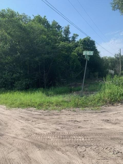 Large corner lot(s) with nearly 1/2 acre (.43) at the south corner of SE 145th Place and SE 28th Court in Belleview Heights.  This quiet wooded lot is waiting for your dream home with plenty of room to grow.  Located between The Villages and Ocala, with easy access to Belleview, Marion Oaks, and Summerfield. One block off Charity Road (145th Street / 475a)