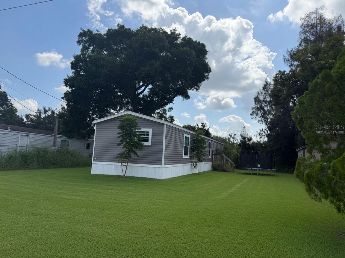 Virtually Staged. Short Sale. Nearly new 2024 manufactured home for sale in Lakeland, Florida! Located at 3035 Crystal Hills Drive in Crystal Acres Estates, this attractive 3-bedroom, 2-bath home offers approximately 1,098 square feet of comfortable living space on a spacious 0.35-acre lot.

The thoughtfully designed split-bedroom floor plan provides added privacy, while the open kitchen and living area creates an inviting space for everyday living and entertaining. Interior highlights include an eat-in kitchen, crown molding, a main-floor primary suite, a walk-in closet and a private primary bathroom. The kitchen comes equipped with a refrigerator, range, microwave and dishwasher.

Additional features include central air conditioning, public water and sewer, vinyl siding, a shingle roof and no deed restrictions. The generous homesite provides valuable outdoor space with room to personalize the property to fit your lifestyle.

Conveniently located in Lakeland’s 33801 ZIP code near shopping, restaurants, schools, Southeastern University, Polk State College, downtown Lakeland and major roadways. This newer Lakeland manufactured home combines modern construction, an efficient floor plan and a larger lot at an appealing price point. Schedule your private showing of 3035 Crystal Hills Drive today!