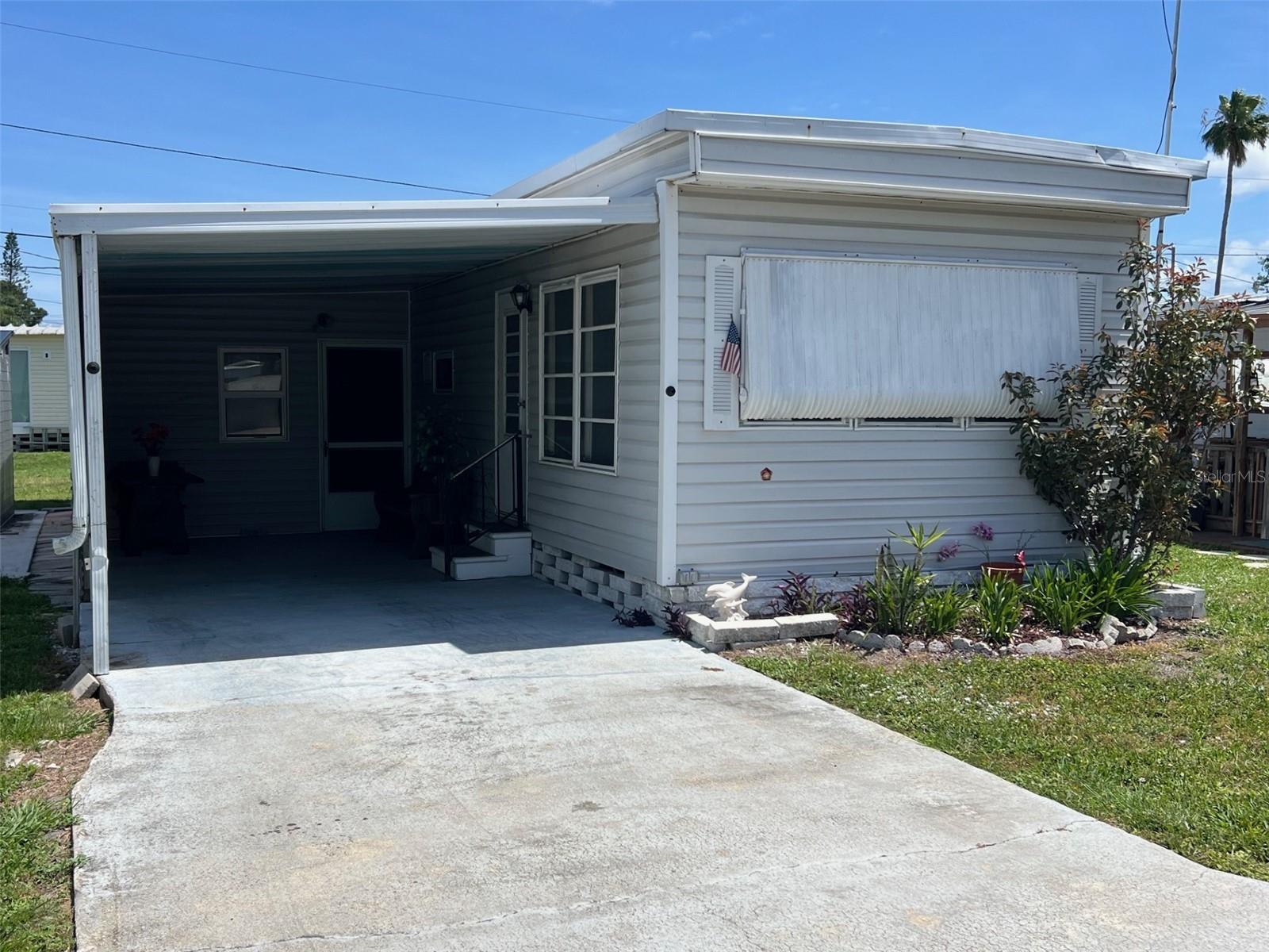 NEW REDUCED PRICE! Discover the charm of this welcoming 55+ mobile home community, often described by residents as friendly, peaceful, and exceptionally well-regarded. At the heart of the neighborhood is a lively clubhouse that serves as the central hub for social gatherings, activities, and connecting with neighbors. New sewers and improved roads are being added to enhance infrastructure and support the community's growth. Enjoy on-site shuffleboard courts for a friendly little competition, with several local golf courses just a short drive away for even more recreation. Conveniently located across the highway from Largo Mall and only minutes' drive from several stunning Gulf Coast beaches, you’ll love shopping, dining, and sandy shores virtually at your doorstep. With a remarkably low maintenance fee of just $192.00 per month covering water, sewer, garbage, and lawn care, affordable Florida living is within reach. This delightful 1-bedroom, 1-bathroom home allows two cats, making it the perfect blend of a carefree coastal lifestyle.
INTERIOR:
Explore the possibilities of this recently listed, fully furnished home, thoughtfully designed for easy living. Laminate flooring flows throughout the main living spaces, complemented by ceiling fans, new drywall and paint, and a wall unit to keep the home cool year-round. The bright living room is a pleasant place to gather with friends, offering an inviting atmosphere and tasteful furnishings that make settling in effortless. Open to the kitchen, you’ll find a refrigerator, range, and oven, with ample room to add an island or small table for easy eat-in dining. The bathroom offers considerable space, highlighted by a long vanity with abundant storage, vinyl flooring, and a classic tub/shower combination. Completing the home is a charming bedroom featuring two closets, providing practical storage and a cozy retreat at the end of the day.
EXTERIOR:
The exterior of this home offers both durability and versatility, featuring low-maintenance vinyl siding, a protective roof over, and awnings that add shade and character. A spacious two-car carport provides ample covered parking and room to relax outdoors. One substantial shed houses a washing machine with a dryer hookup and includes a bonus room perfect for extra storage of larger items—or you may choose to transform it into an exercise space, craft room, or art studio…the choice is yours! An additional freestanding shed is ideal for storing yard tools and outdoor equipment. The backyard is quite spacious with plenty of room for a seating area and grill for a cookout with family and friends. Priced at $48,000, including the share, this is a value-driven opportunity ready for you to personalize and make this property your own. Call soon to schedule your private showing!
