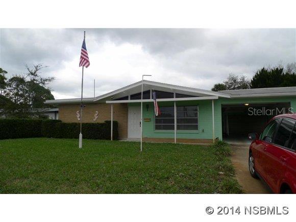 Picture not using your car to go to the shopping center, the public library or Veteran's Park on the river in Edgewater FL. This 3 bedrooms, 2 full baths is close to all of that, and offers terrazzo floors, a 2 car garage and a 651 square feet covered patio ideal for a cookout with family and friends.  A private well and sprinkler system helps you with your gardening projects. The large open and bright living and dining area also make it easy to live in this home. Brand new A/C in 2014 & roof in 2003. ;Water: City