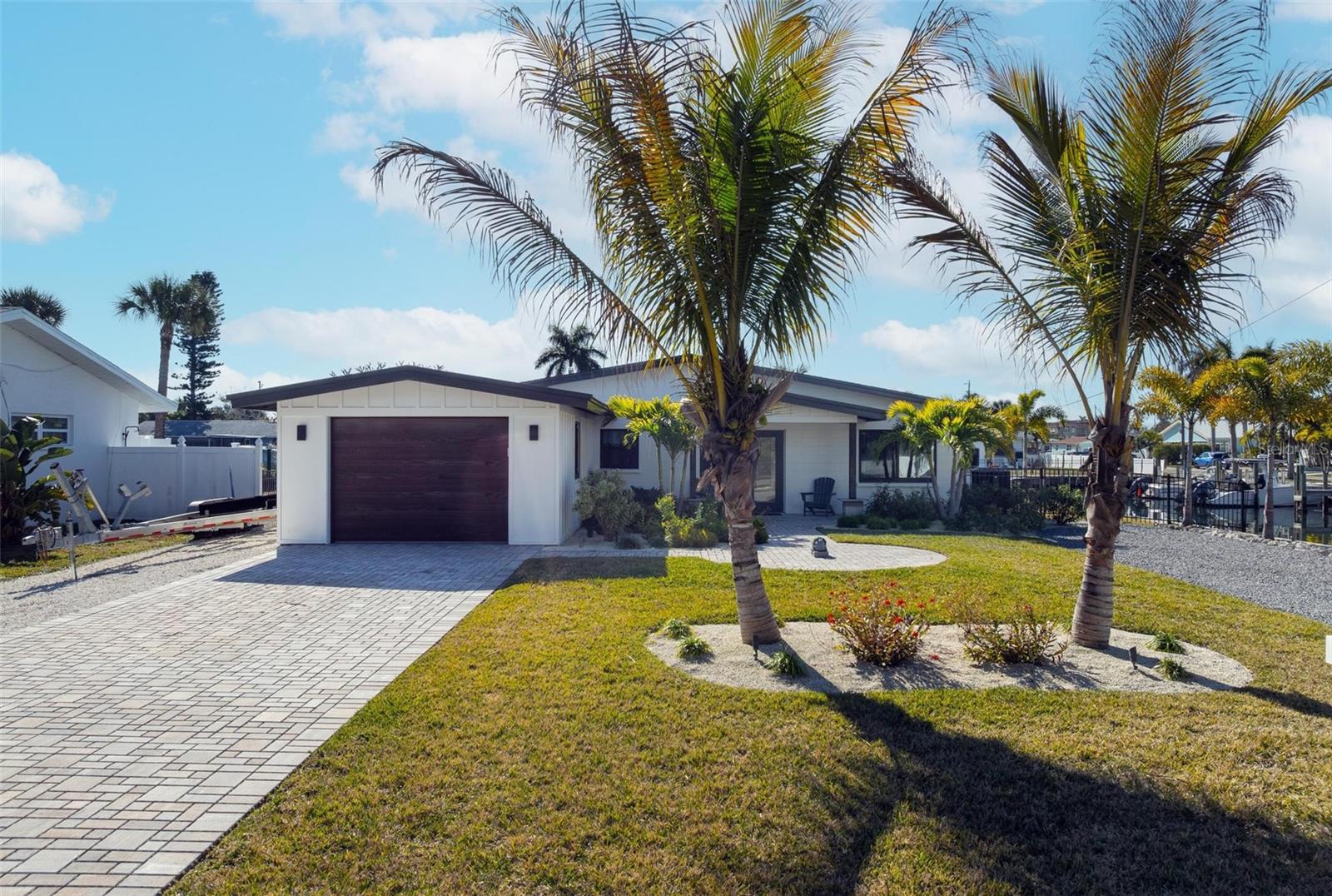~Best Waterfront Value on the Island~
Welcome to your turn-key island retreat, a meticulously reimagined 3-bedroom, 2-bathroom waterfront home where thoughtful renovation meets serious boating credentials. Every inch of this property has been brought back to better-than-new condition through a complete renovation that included a comprehensive storm damage remediation strategy, giving you confidence in both the craftsmanship and the long-term resilience of your investment.
Boaters, take note: this property boasts the closest boat lift to the beach north of Cortez — just a short distance to the sand and surf, giving you the best of both worlds. A heavy-duty 13,000 lb private lift stands ready for your vessel. With a remarkable 200 feet of waterfront on the canal, you'll have room to spare for water toys, dockside lounging, and quick deep-water access to the Gulf. Whether you're chasing tarpon at sunrise or cruising to a sandbar at sunset, you're already there.
Step inside and discover an upgraded kitchen built for entertainers and home chefs alike, anchored by premium Thor appliances and an abundance of custom cabinetry that delivers both style and storage. The open layout flows seamlessly to your private outdoor oasis — a sparkling pool, relaxing spa, and convenient outdoor shower set the scene for everyday vacation living. A separate laundry room and attached garage add the everyday practicality that makes island life effortless.
Tucked into a quiet pocket in the heart of the island, this home offers the rare combination of central location and peaceful surroundings. Best of all, there are no HOA fees — and dedicated parking accommodates your RV, boat trailer, or extra vehicles. 
Whether you're searching for the perfect second home to escape to season after season, or you're ready to make the leap to sunny Florida living full time, this property delivers on every front. Renovated, resilient, and ready to enjoy — this is coastal Florida living without the typical trade-offs.
