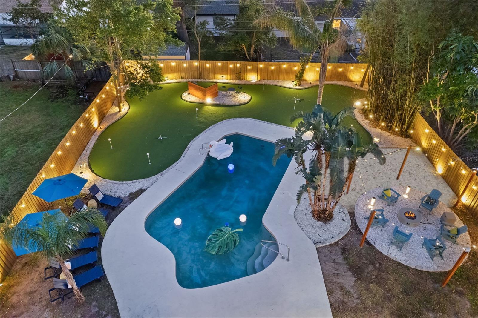 Welcome to “The Jewel” a professionally designed Seminole pool home that has become one of the area’s standout short-term rental properties, consistently performing among the top 5% of STRs in the market. Just minutes from Indian Shores, Redington and Madeira Beaches, this fully renovated and thoughtfully curated retreat blends luxury design, resort-style amenities, and exceptional entertainment spaces into one unforgettable property.

Inside, the home features a stunning designer interior with bold jewel-toned accents, custom wallpaper, elevated lighting, curated furnishings, and upscale finishes throughout. The open-concept layout was designed for entertaining, anchored by a gourmet kitchen with custom cabinetry, stone countertops, stainless steel appliances, and expansive gathering spaces that flow seamlessly throughout the home. A converted game and entertainment space adds flexibility and guest appeal, creating the ultimate vacation-style experience.

The backyard is completely fenced in for privacy and has been perfectly transformed into a private resort-inspired oasis featuring a heated pool, custom putting green, tiki bar, fire pit lounge, designer landscape lighting, outdoor entertainment areas, and multiple gathering spaces designed for relaxation and recreation. Extensive recent upgrades include the roof (2023), water heater (2023), Rheem HVAC system (2017), pool heater addition (2025), mini-split climate control system (2025), updated impact sliding doors (2024), upgraded lighting throughout, and numerous additional designer and functional improvements.

Offered fully furnished, turn-key ready and ideally located in unincorporated Seminole near Gulf beaches, parks, shopping, dining, and the Pinellas Trail. Located in a non-flood zone with no flood insurance currently required, this property offers added peace of mind and long-term ownership value, a rare advantage this close to the Gulf beaches.“The Jewel” presents a rare opportunity to own a beautifully upgraded home with proven luxury short-term rental success and outstanding lifestyle appeal.