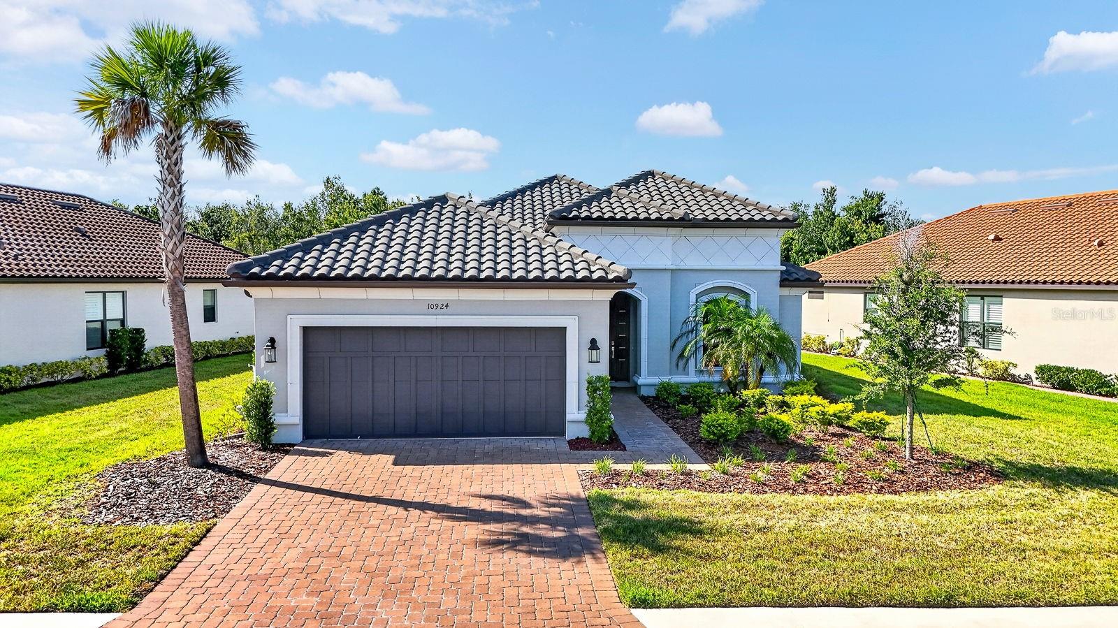 Private preserve views, a custom outdoor kitchen, an expansive screened lanai, three private ensuite bedrooms, and remarkable near-new condition make this one of the most distinctive Farnese homes in Artisan Lakes Esplanade.
Beautifully maintained and presenting in exceptional condition, this 2022 Taylor Morrison home offers a rare combination of upgrades, privacy, and thoughtful design seldom found in a single property. The sought-after Farnese floor plan features 3 bedrooms, 3.5 bathrooms, and a dedicated office/flex space with elegant glass French doors, providing versatility for working from home, hobbies, fitness, or additional living space. The convenience of single-story living further enhances the home's appeal in one of Palmetto's premier resort-style communities.
Highly sought after for its thoughtful design and versatile layout, this Farnese floor plan features the desirable three-ensuite-bedroom configuration, a layout especially prized for the privacy, comfort, and flexibility it provides. Combined with a custom outdoor kitchen, an extended screened lanai, and peaceful preserve views, this home offers a unique blend of luxury and livability. The private ensuite layout is ideal for everyday living, long-term guests, and multigenerational living arrangements, allowing everyone to enjoy their own comfortable and private retreat.
The open-concept layout creates a seamless flow between the kitchen, dining area, and great room, making the home feel both spacious and inviting. Eight-foot triple pocketing glass sliders fully open to the home's true showpiece—an incredible outdoor living space designed to embrace the Florida lifestyle.
The extended screened lanai features a brand-new custom outdoor kitchen, beautiful pavers, and peaceful preserve backdrop with no rear neighbors. Whether enjoying a quiet morning coffee, dining outdoors, or gathering with friends, this private outdoor retreat was designed for year-round enjoyment. With plenty of room to add a pool, the backyard offers the opportunity to create the outdoor oasis of your dreams while maintaining the privacy and natural beauty of the preserve setting.
Combining near-new condition with thousands of dollars in completed upgrades, this home offers the best of both worlds. Enjoy the benefits of newer construction without the wait, uncertainty, or expense of adding major improvements after closing. From the pristine condition and extensive upgrades to the custom outdoor living space, everything has already been completed and is ready to be enjoyed from day one.
Ideally situated close to the amenity center, residents enjoy the exceptional lifestyle that has made Artisan Lakes Esplanade one of the area's most sought-after communities. Resort-style amenities include two luxurious pools, a fitness center, pickleball, tennis and bocce courts, game rooms, social events, and beautifully maintained grounds.
The HOA provides outstanding value by including lawn maintenance, landscaping, cable television, and high-speed internet, creating an easy, low-maintenance Florida lifestyle.
Conveniently located near I-75, this home offers easy access to Tampa, Sarasota, Lakewood Ranch, St. Petersburg, premier shopping and dining, medical facilities, airports, and Florida's world-famous Gulf Coast beaches.