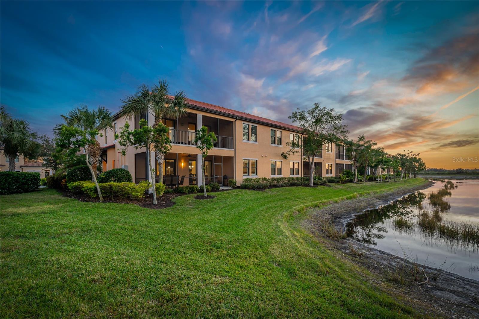 RECENT PRICE REDUCTION AND READY TO ACCEPT YOUR OFFER:  Privacy And Beauty Await You In This Truly Rarely Available Just Under 1600 Square Foot WCI Built Maintenance-Free First Floor End Unit Condominium With Private Side-Entry, Two Bedrooms, 2 Baths With Den Or "Flex Room" Nestled On The End Of Banbury Way's Majestic Palm Tree Lined Cul De Sac On The "Lake Side" Of The Renowned 2400 Acre Gordon B. Lewis Golfing Community Of Sarasota National Golf And Country Club. The Thoughtfully Designed Freshly Painted Open Floor Plan With Impressive Center Kitchen Island Is Further Complimented By Luxurious Upgrades From The Newly Installed Contemporary Ceiling Fans, Solid Wood Cabinetry, Quartz Countertops, Crown-Molding And Upgraded Flooring. The Single Car Garage Is Unique To This Unit As It Boasts Two Extra Feet For Extra Storage Or A Larger Than Most Vehicle. The Condo Association Replaced The Roof in 2023 And The Current Owners Thoughtfully Have Replaced The A.C. Blower Motor And Garbage Disposal. An Early Morning Cup Of Coffee Or An Evening Glass Of Wine Or Dinner With Friends Or Family On Your Double Lanai While Overlooking The Extra-Large Pond And Surrounding Preserves With Its Ever-Changing Mother Nature Painted Color Scheme Is Only Further Enhanced By The Myriad Of Native Florida Birds That Visit Or Call The Protected Audubon International Silver Signature Preserve And Sanctuary Home - Which Is Certainly A Lovely Added Feature Of Living In The Sarasota National Gated Community. The Fully Featured Amenity Rich True Resort Community Offers Miles Of Bike Or Jogging Trails, Social Clubs And Robust Planned Events Coordinated By The Full Time Activity Director, A Full Time Dining Director For Its Two Restaurants And Pool-Side Tiki Bar Plus A 8000 Square Foot Fitness Center With A Full Compliment Of Fitness Equipment And A Myriad Of Scheduled Fitness Classes Highlighted By Recently Expanded Pickleball Courts, Tennis And Of Course A Dog Park. A Golf Pro Shop And An Exclusive Golfer Bar And Restaurant Is Designed With The Resident Golfer's Convenience In Mind. A 15-20 Minute Ride Brings You To A Multitude Of Beaches Or The Single Proprietor Restaurants And Free Outdoor Entertainment Performances Located In The Up And Coming Wellen Park Community Or On Venice Island. If More Of An Urban Vibe Is What You Seek Downtown Sarasota And Its Accompanying Airport Is But A 35 Minute Ride Away. Whether You Are Planning On Relocating, Hoping To Getting Away From The Cold-Seasonally, Or Hoping To Having A Return On A Prudent Investment This Opportunity Will Surely Check The Boxes.