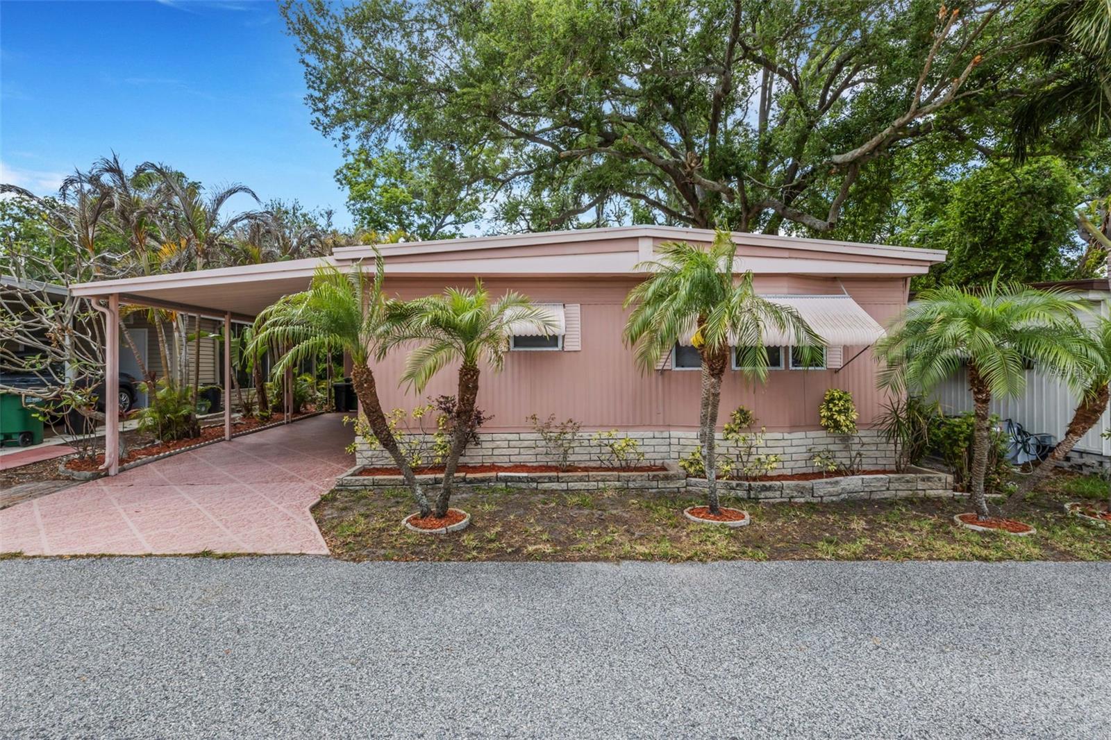VERY MOTIVATED SELLERS! PRICE JUST REDUCED AGAIN! Welcome to your beautifully furnished retreat, perfectly situated on a dry lot in an X flood zone, offering peace of mind and privacy. This well-maintained home showcases a stunning tropical wooded backdrop, complete with a serene, meandering stream that creates a truly picturesque and tranquil setting. Inside, the home has been thoughtfully cared for, including upgraded ¾-inch plywood subflooring for added durability. The property has been regularly inspected underneath, and the roof-over adds extra protection and longevity. Located in the highly sought-after Briar Creek community, this property includes deeded land, an exceptional value. Residents enjoy a friendly neighborhood atmosphere with winding roads and majestic, mature trees that enhance the natural beauty of the area. The monthly maintenance fee of only $220 covers an impressive array of amenities, including water, sewer, trash service, lawn care, private roads, and access to the clubhouse. Relax and unwind at the heated pool and spa, enjoy a game of shuffleboard, or take advantage of the convenient on-site laundry facility and community mart for buying and donating gently used items. This pet-friendly home allows cats only. Conveniently located near numerous medical facilities, including a nearby hospital, this home offers both comfort and accessibility. If you’re seeking a private, nature-inspired setting within a welcoming and well-maintained community, this is the perfect place to call home. Room measurements are approximate, buyer responsible to verify.