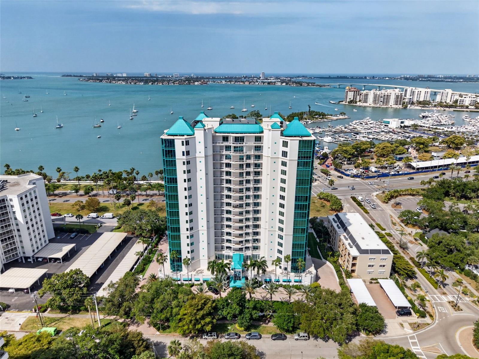 Set along the iconic South Palm Avenue, renowned for its quiet sophistication and gallery-lined streets, Residence #14 at Sarabande Sarasota offers a rare opportunity to own a home defined by protected, unobstructed views of Sarasota Bay.  THIS is Palm Avenue living at its most refined, where a neighborhood-like setting meets effortless access to art galleries, boutique shopping, acclaimed dining, and Whole Foods Market all just moments away, yet peacefully removed from the pace of downtown. A THOUGHTFULLY DESIGNED RESIDENCE:  Spanning 1,776 square feet, this residence offers two bedrooms + an office/den and two bathrooms, designed with both privacy and versatility in mind.  A PRIVATE GUEST SUITE positioned at the entrance of the residence creates a welcoming yet secluded experience for visitors.  A MULTI-FUNCTIONAL OFFICE/DEN, complete with an in-wall Murphy bed, easily transforms into a third bedroom. THE OPEN CONCEPT KITCHEN is spacious and inviting, perfect for those who love to cook while remaining connected to guests. THE GREAT ROOM is filled with natural light and framed by lush palm-lined greenery, creating a serene backdrop that enhances the home’s tranquil ambiance.  THE VIEW:  Protected, Enduring, Exceptional!  WHAT truly elevates this residence is its unique positioning on the first full level of residences, offering a rare combination: 1 - Peek-a-boo yet unobstructed view of Sarasota Bay. 2 - A vantage point that balances privacy, greenery, and water 3 - Protected sightlines that enhance long-term value and desirability. Enjoy city and bay views from the great room primary suite and terrace, an understated yet powerful feature for the discerning buyer seeking a view that endures.  STEP onto your private terrace, perfectly suited for al fresco dining, morning coffee, or sunset evenings overlooking the bay. ELEVATED COMFORT AND CONVENIENCE:  DEDICATED laundry room with sink and stackable washer/dryer.  ONE secured parking space, pre-wired for an EV charger. A Private storage unit for storing extra must haves.  AMPLE guest parking allows friends and family to visit with ease.  A BUILDING THAT WELCOMES YOU HOME! Sarabande Sarasota has recently undergone thoughtful enhancements, including:  A refreshed lobby with an inviting arrival experience. Exterior repainting and upgraded elevator systems. THE result is a building that feels polished, welcoming, and aligned with today’s luxury expectations.  AMENITIES Designed for Lifestyle & Wellness: Residents enjoy a well-appointed collection of amenities, including: -Club Room for entertaining and social gatherings   -Board/Conference Room for business needs -Two pools, including a dedicated lap pool -Spa and steam room for relaxation and rejuvenation. There is also a Fitness center with a private room to accommodate personal massage services.  Enjoy the outdoor grilling area for casual entertaining poolside. A lifestyle that seamlessly blends wellness, convenience, and community.  THE PALM AVENUE LIFESTYLE - For the buyer seeking a quiet, refined setting with protected Sarasota Bay views, Residence #14 offers a compelling opportunity where location, layout, and lifestyle align with intention.  SCHEDULE your private showing and experience Palm Avenue living firsthand.