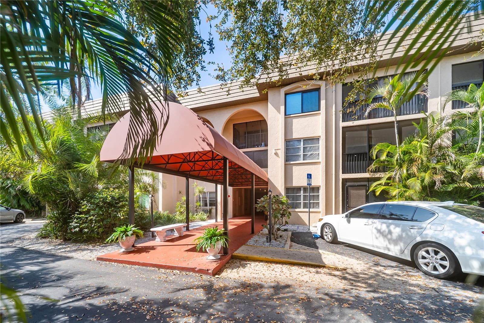 Welcome to your slice of Sarasota paradise! This vibrant, first-floor condo is the ultimate tropical retreat, located just four miles from the world-renowned sands of Siesta Key Beach and a mile from Southside Village. Whether you are searching for a savvy investment, a seasonal vacation getaway, or a low-maintenance primary residence, this home is perfectly positioned for the Florida lifestyle.

This move-in ready, west of the trail home, boasts a comprehensive interior renovation that blends modern convenience with natural beauty. The heart of the home is the stunning kitchen, which features brand-new modern white cabinetry, sleek stainless steel appliances, and gorgeous live-edge countertops that provide a unique and organic focal point for your living space.

The upgrades continue throughout the entire unit with fresh new flooring, updated fans, and contemporary lighting that create a bright and welcoming atmosphere. The bathroom has been fully refreshed with a new vanity and sinks, ensuring every inch of this home feels crisp and current. Major mechanical updates provide long-term peace of mind, including a water heater installed in 2021 and an air conditioning system from 2017. You will also enjoy the convenience of an indoor laundry room inside the unit. The community recently benefited from a newer roof, providing peace of mind for years to come. Your assigned parking space is situated right in front of your door, making it a breeze to load up your gear for a day at the beach or a trip to the nearby parks.

The location is truly unbeatable and keeps you in the heart of everything Sarasota has to offer. You are within walking or biking distance to the Crossings at Siesta Key, where you will find a Publix grocery store, a variety of dining options, and excellent shopping. The neighborhood is also conveniently close to Sarasota Memorial Hospital and a curated selection of upscale local restaurants. With water, sewer, and trash included in the maintenance fee, you can spend less time worrying about bills and more time enjoying the nearby bridge to the coast. Do not miss your chance to own in one of the area's most sought-after hotspots!